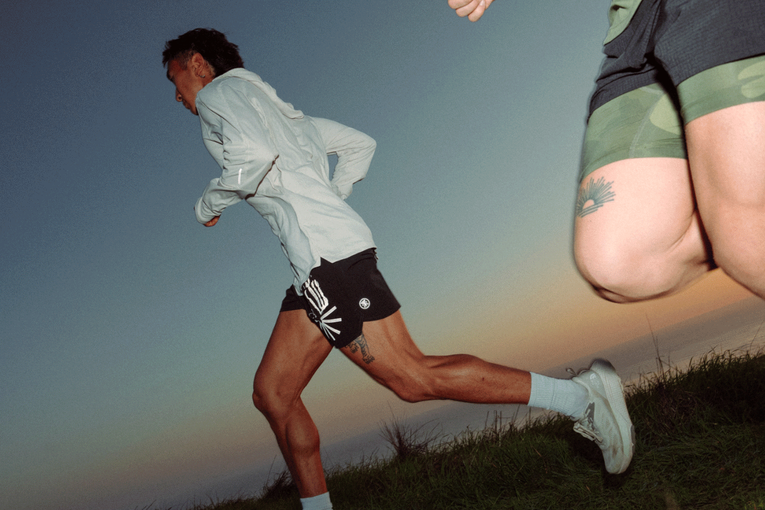 Close-up of rugged outdoor footwear and durable shorts, perfect for adventurous travels and exploring the unknown - Roark inspired.