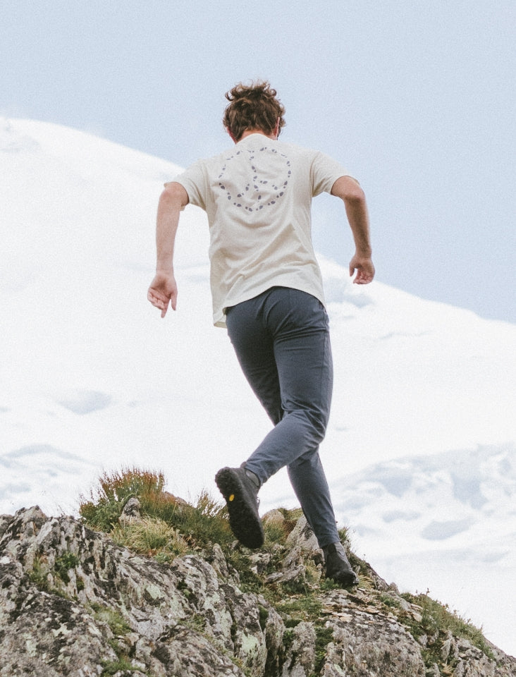 Group of adventurers running through a wild landscape, embodying the spirit of exploration and leisure in nature