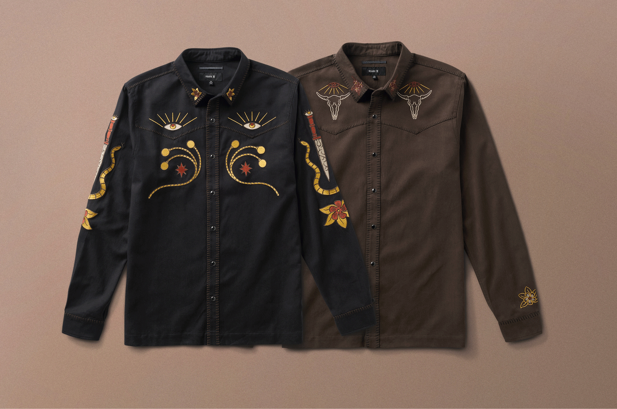 Stylish adventurer in embroidered shirt with fedora, showcasing Roark's commitment to travel and outdoor-inspired fashion.