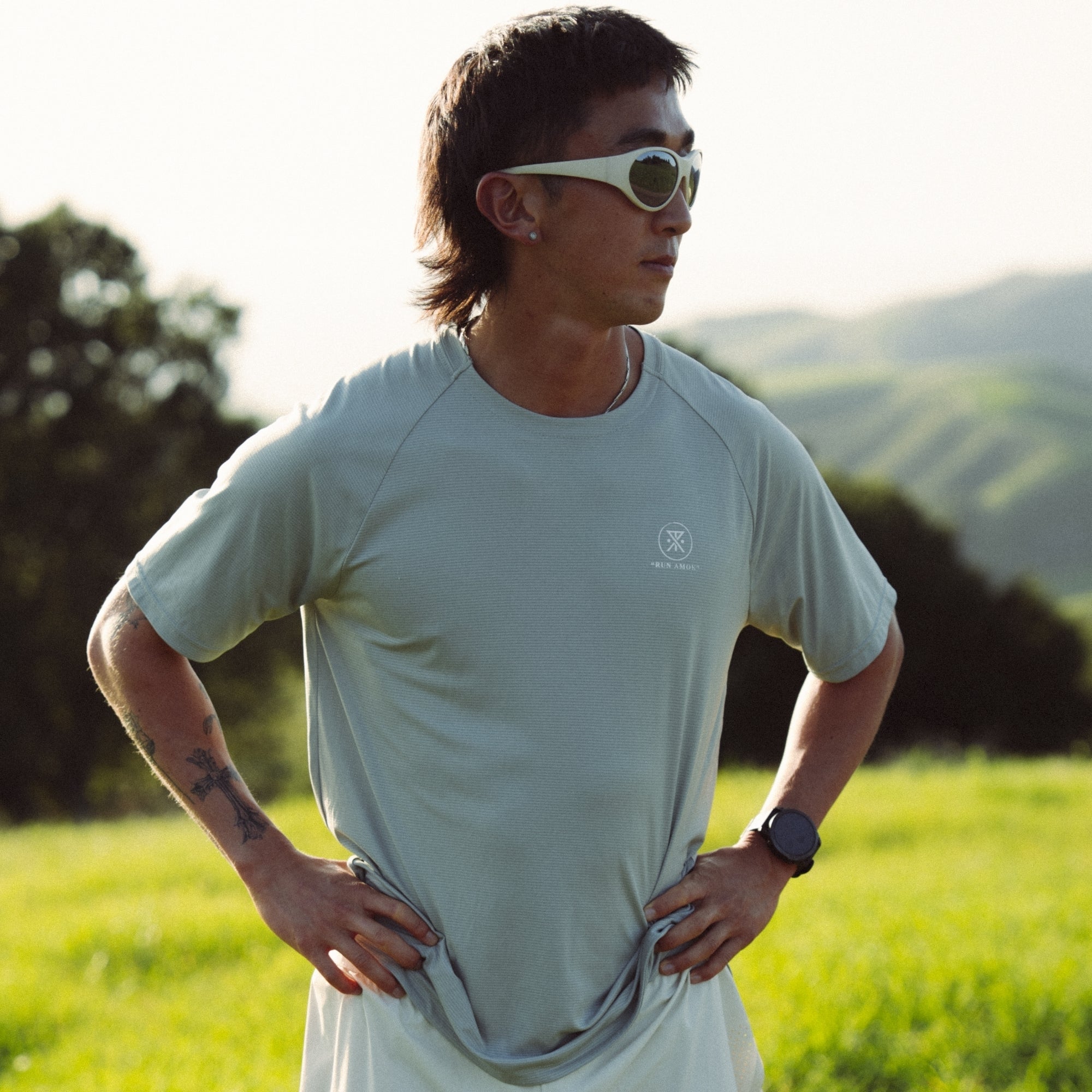 Active person wearing Roark's Alta Elite Trail Short Sleeve Tee, styled for outdoor adventure and recreation, showcasing the comfortable sportswear in a dynamic setting.