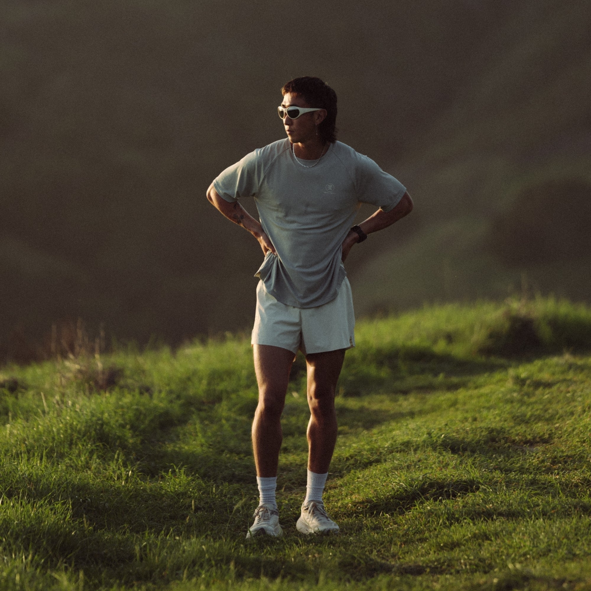 Active outdoor enthusiast wearing trail running shorts in a natural setting, epitomizing Roark's adventure and travel spirit