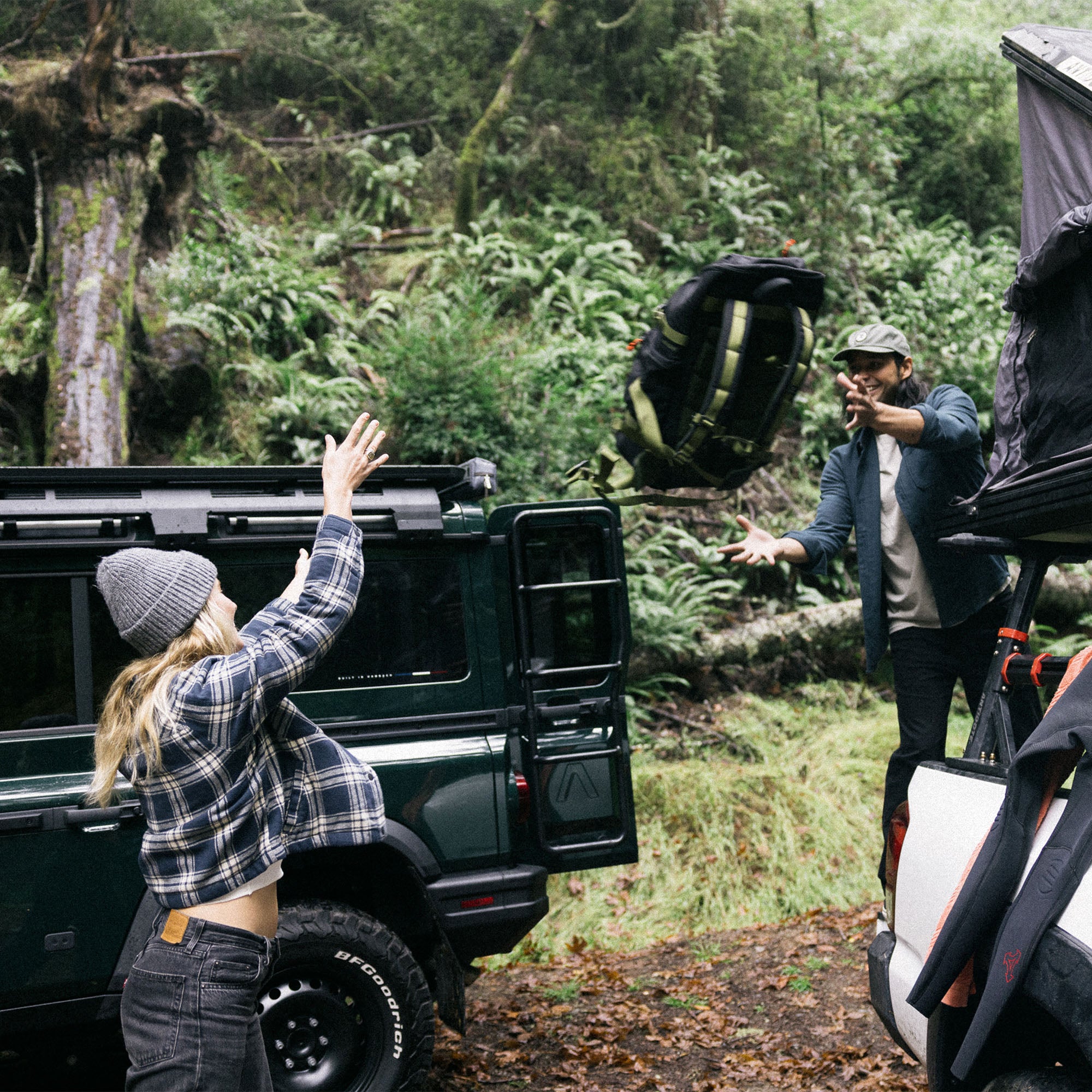 Adventure-ready Backwoods Jacket showcased on a car rack in a rugged outdoor setting, emphasizing travel and exploration.