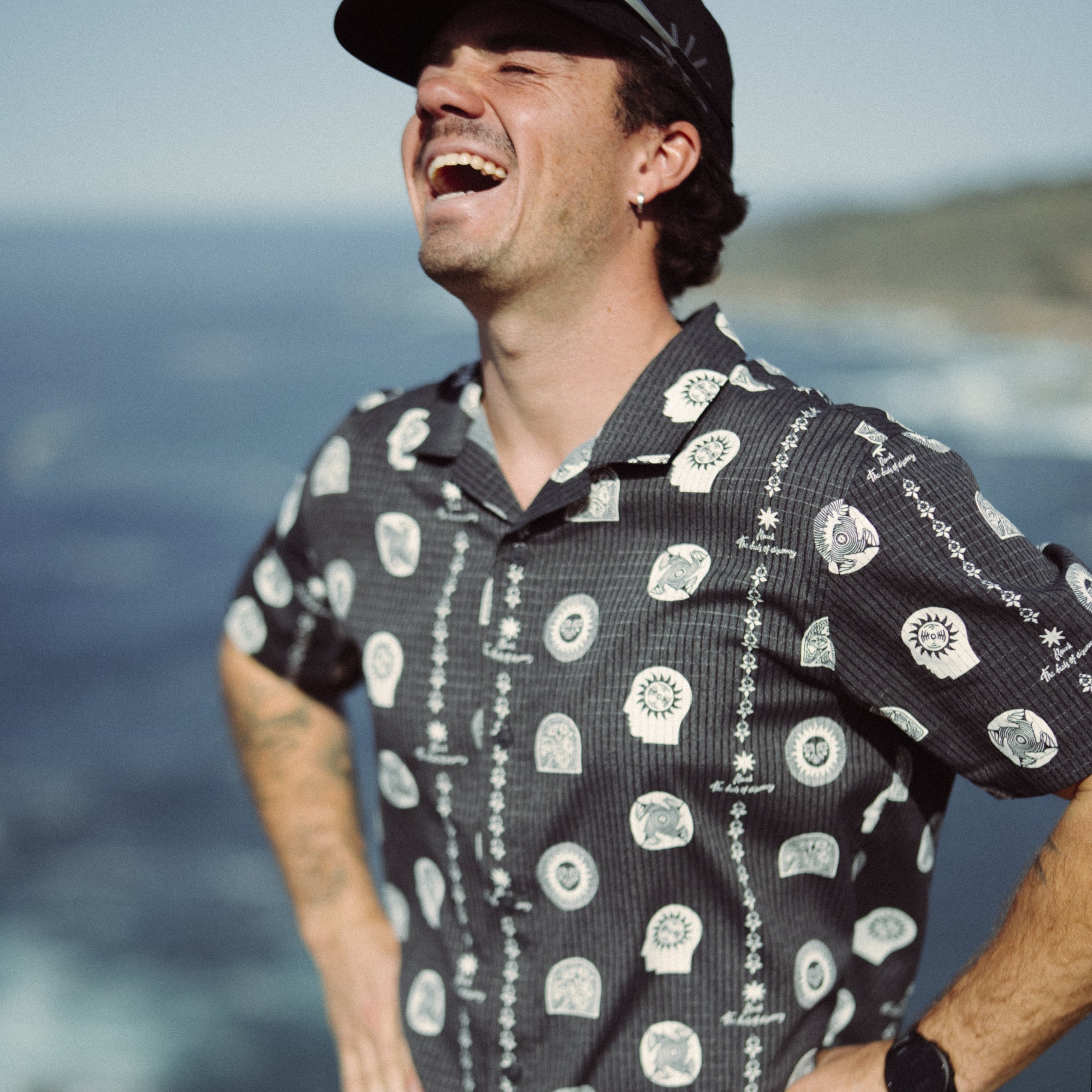 Adventurous individual wearing an active shirt with a collar, sun hat, and headgear, ready for a trail adventure