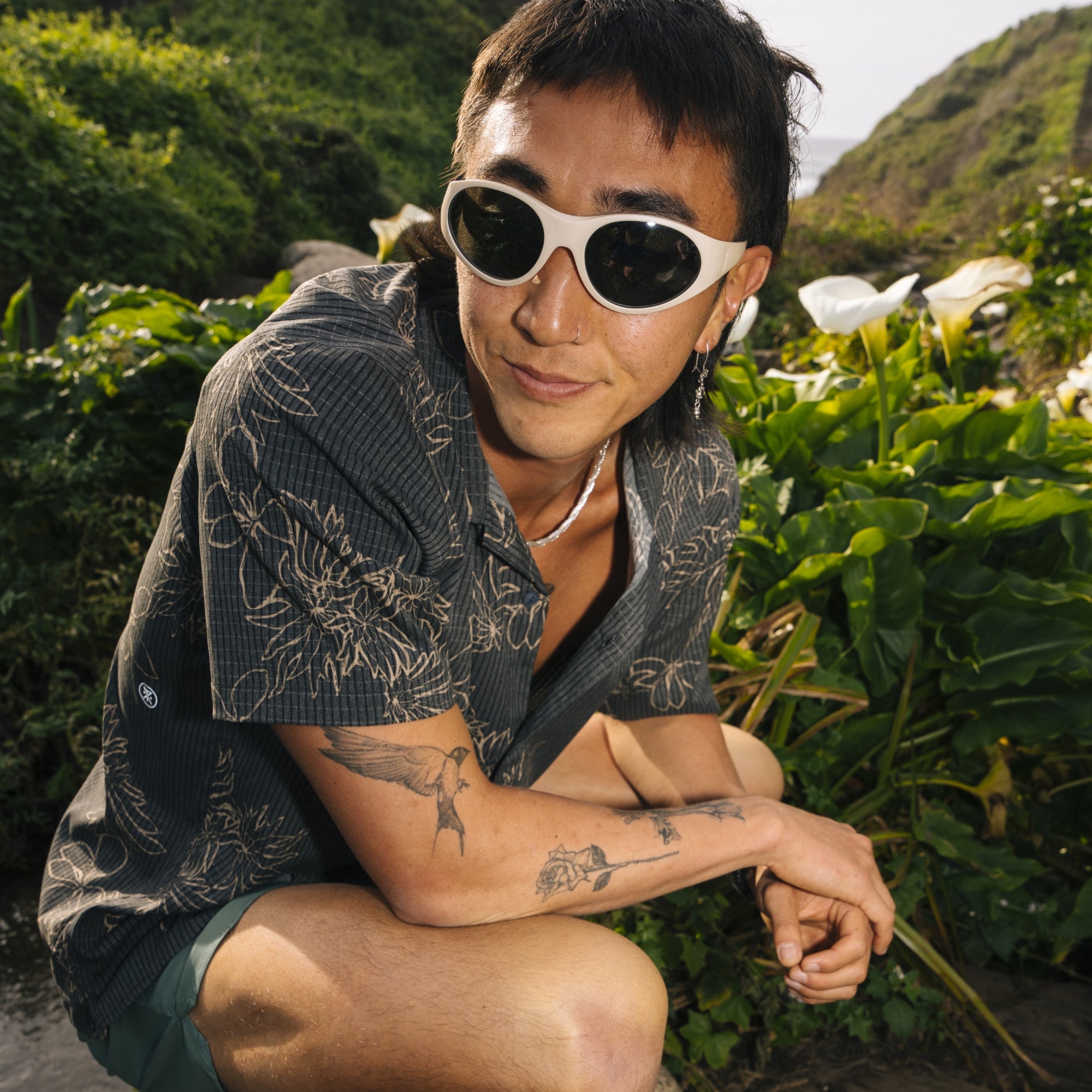 Sunglasses designed for outdoor adventures on a blurry nature trail background, embodying a spirit of exploration and robust vision care.