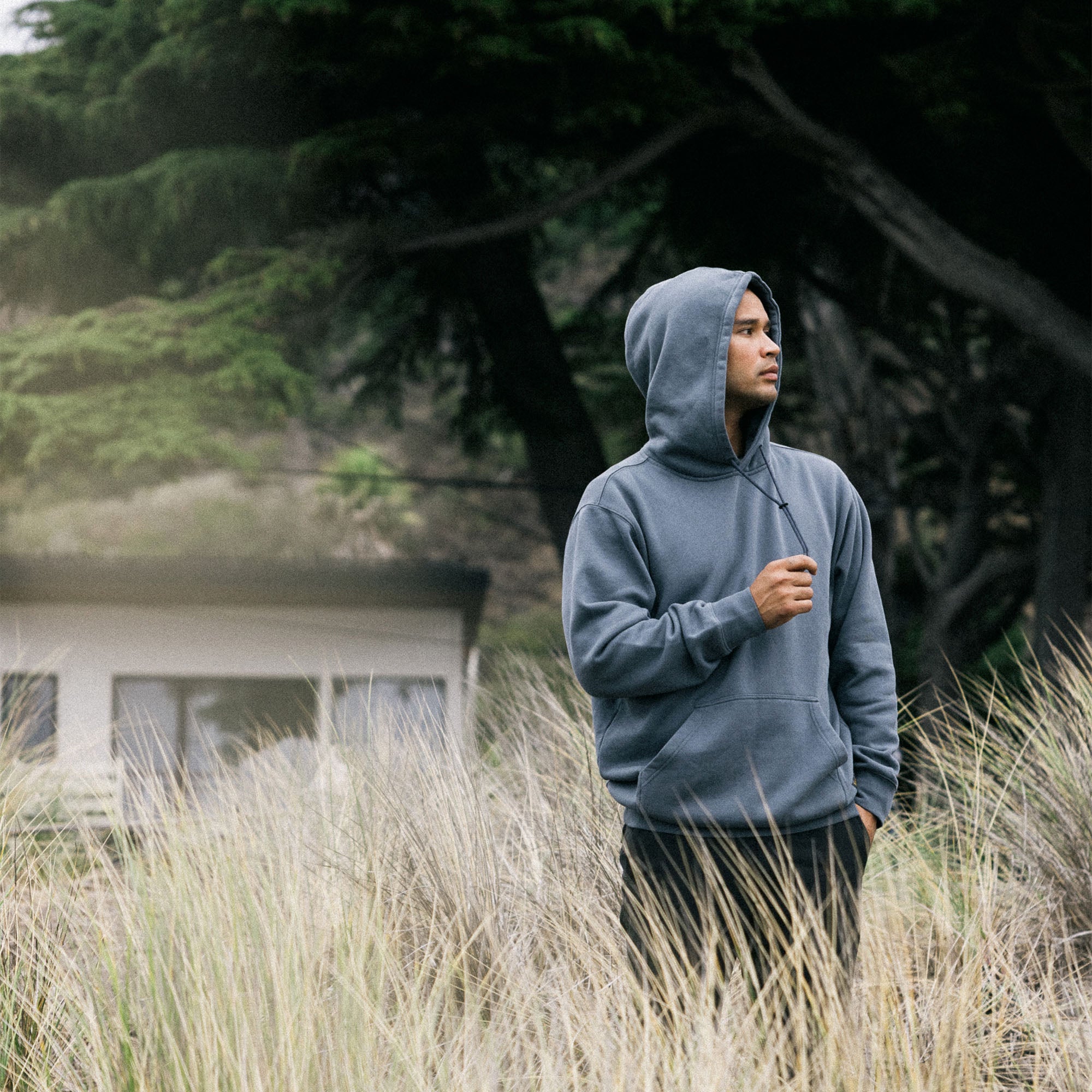 Grey mist Bolo fleece hoodie by Roark featuring long sleeves and a comfortable hood, perfect for outdoor adventures and cozy travels.