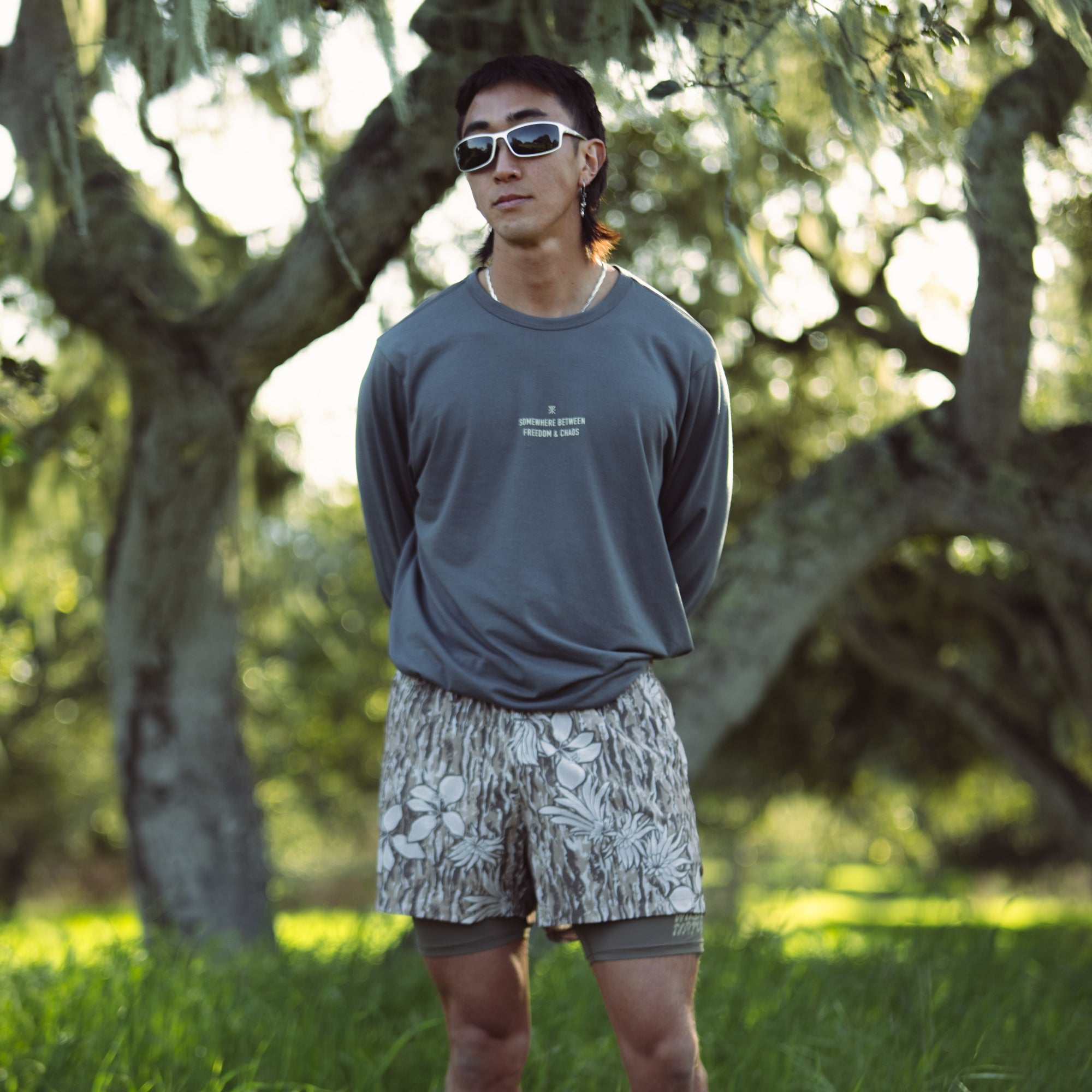 Athletic man wearing Roark active shorts and shirt, ready for adventure