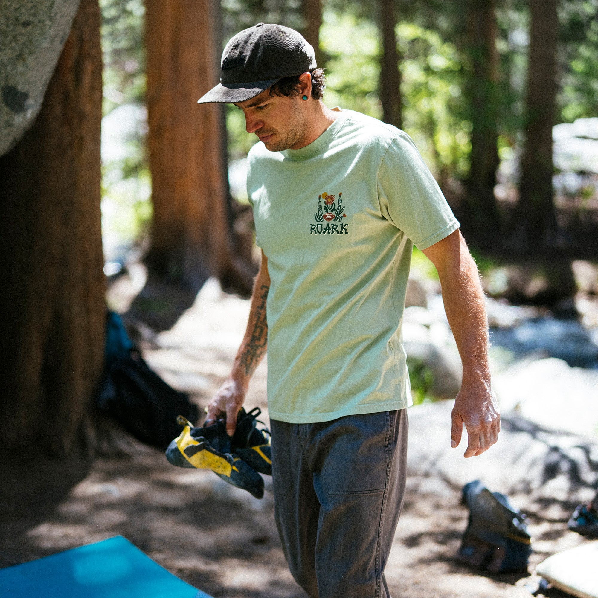Group of adventure seekers wearing caps and enjoying a sunny day in a cactus garden, embodying the spirit of outdoor recreation.