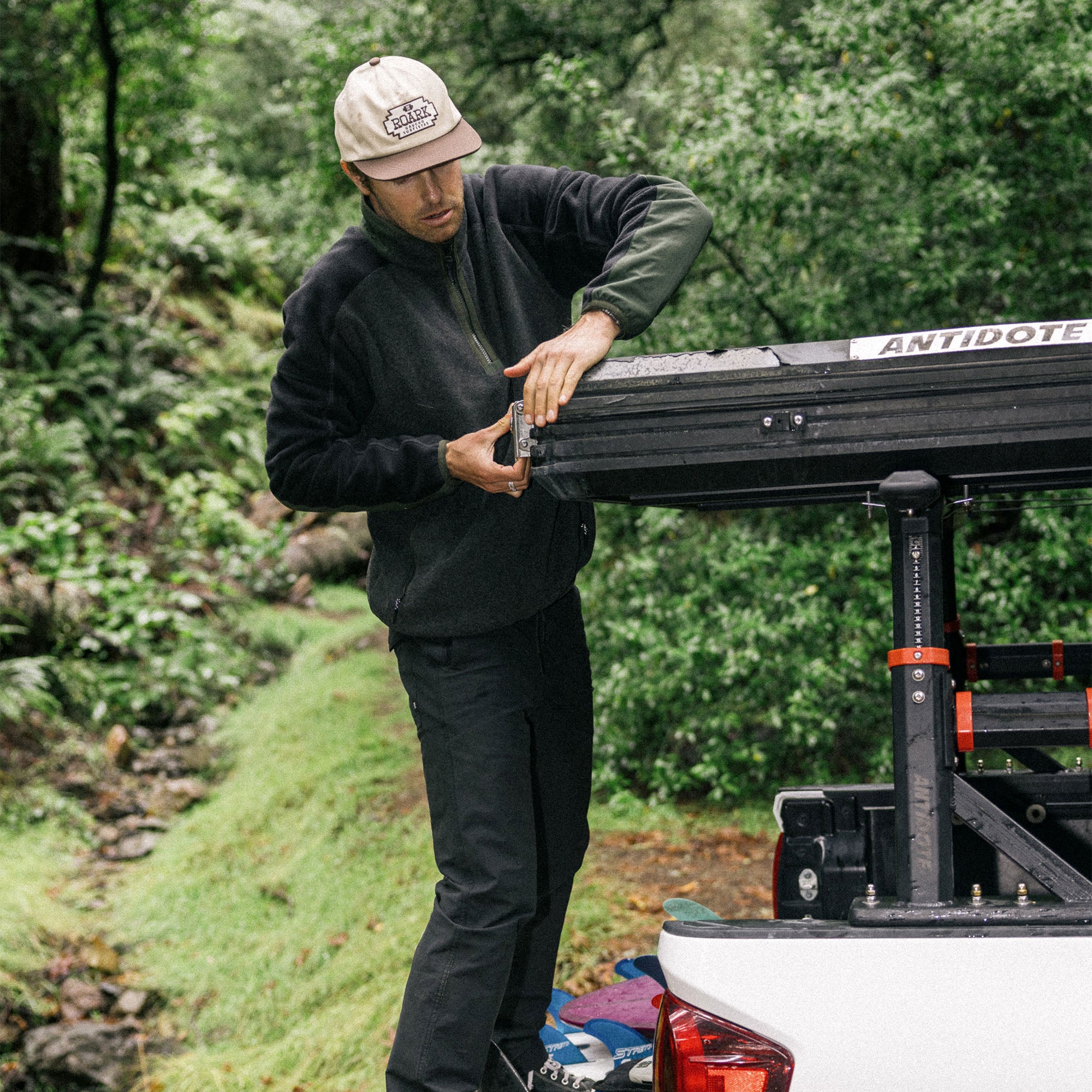 Stylish baseball cap perched atop a Roark Campover Fleece Mock Hoodie, embodying the spirit of adventure and outdoor exploration.