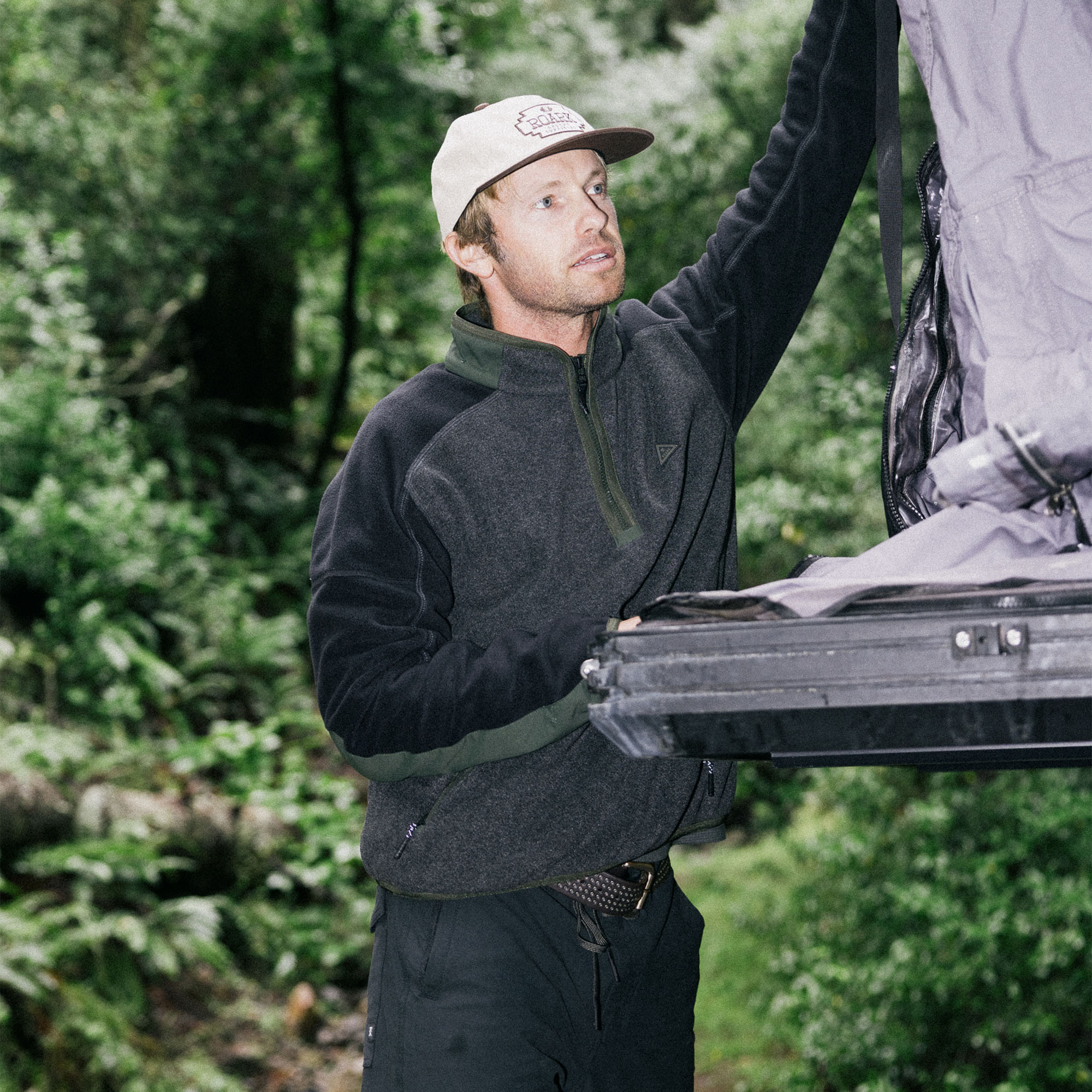 Roark Campover Fleece Mock Hoodie styled with a winter hat and baseball cap for an adventurous outdoor look.