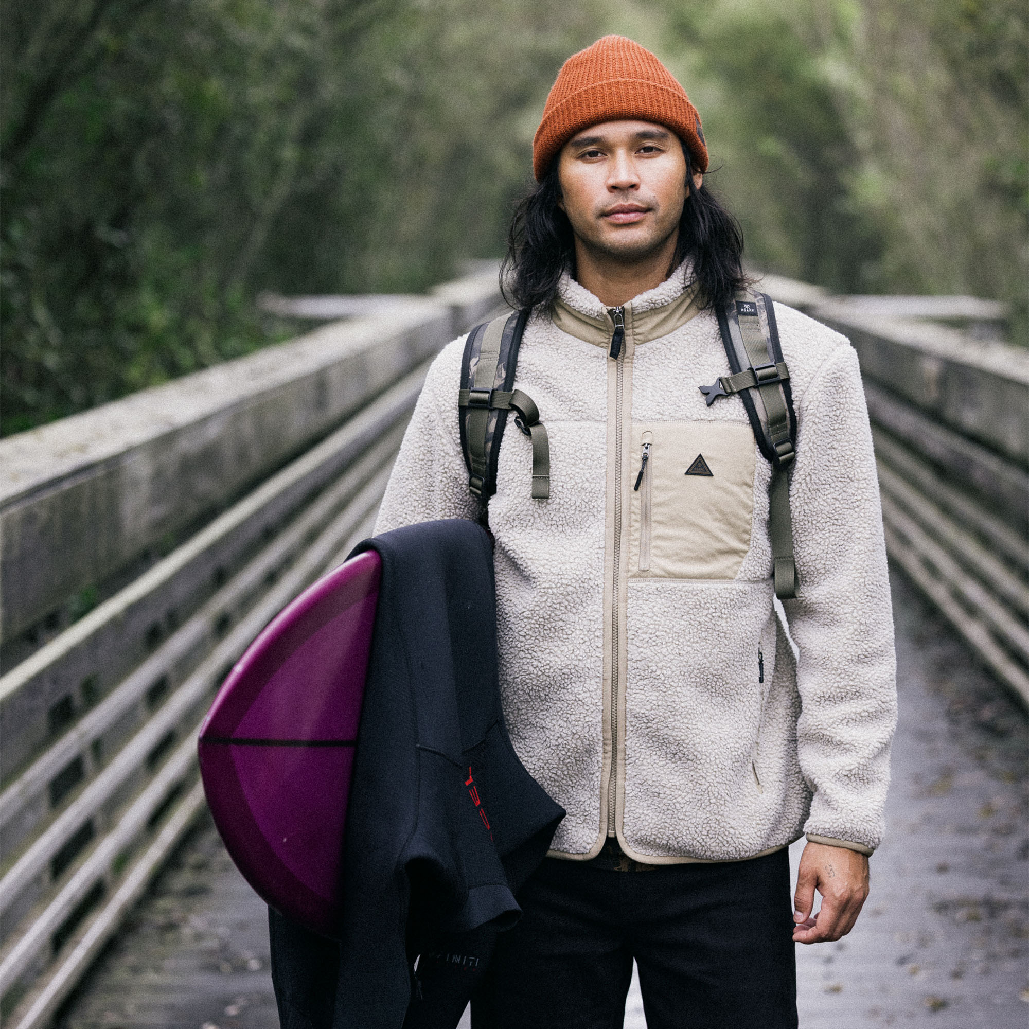 Man in Campover Fleece Zip Hoodie with beanie enjoying a winter trail adventure