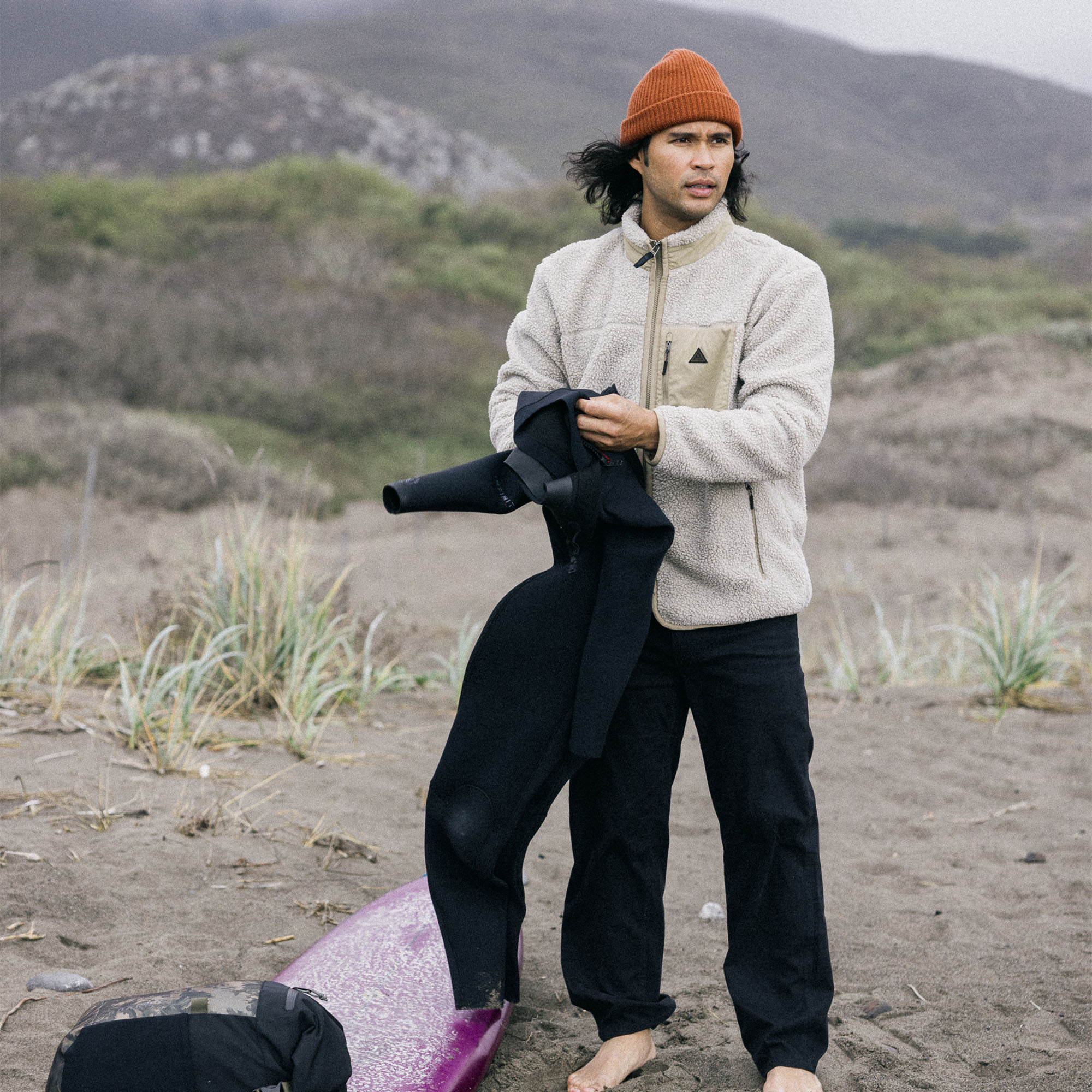 Person wearing a cozy Campover Fleece Zip Hoodie with a hat, enjoying winter outdoor activities