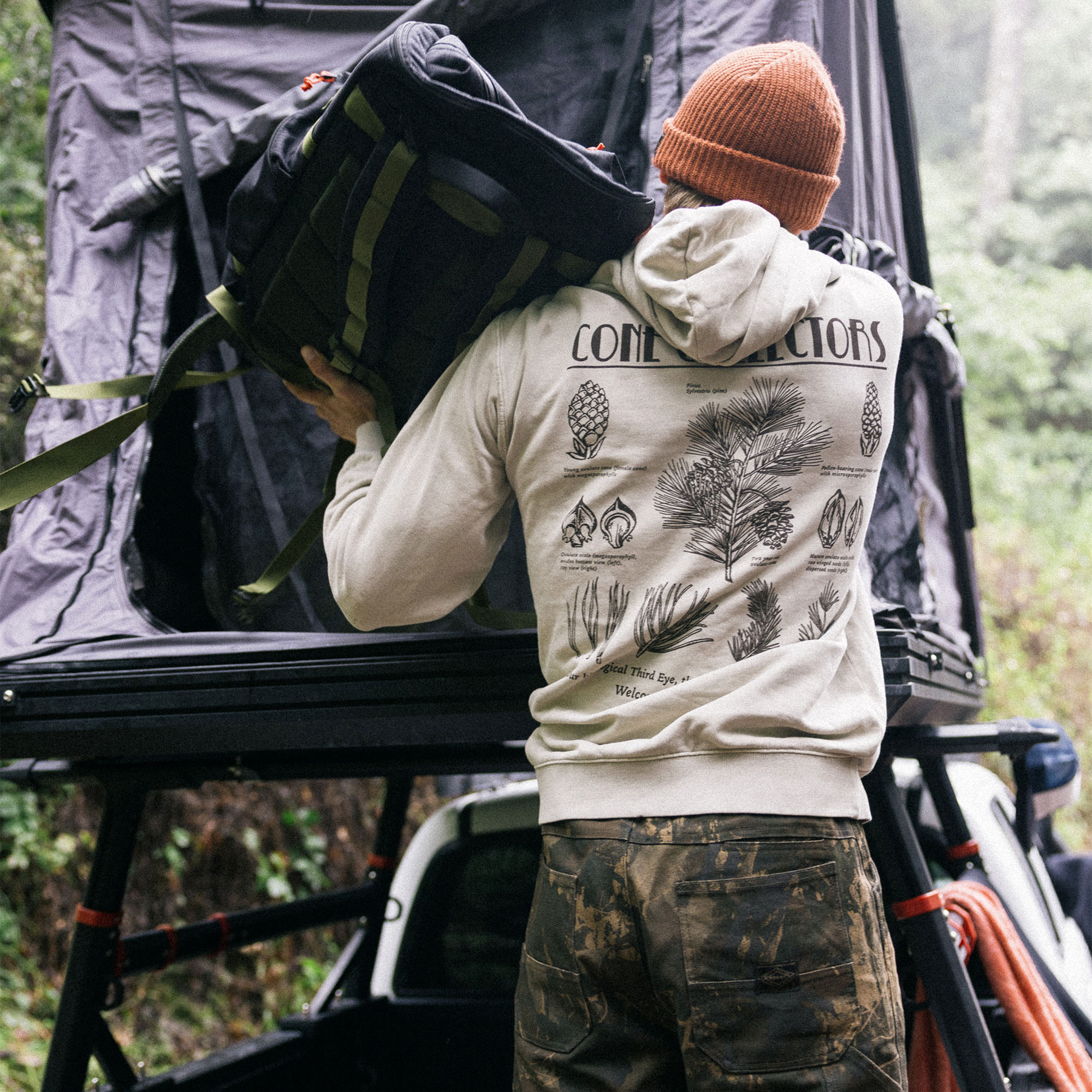 Backpacker dressed in cargo pants carrying a spacious backpack, prepared for adventure with warm fleece gear.