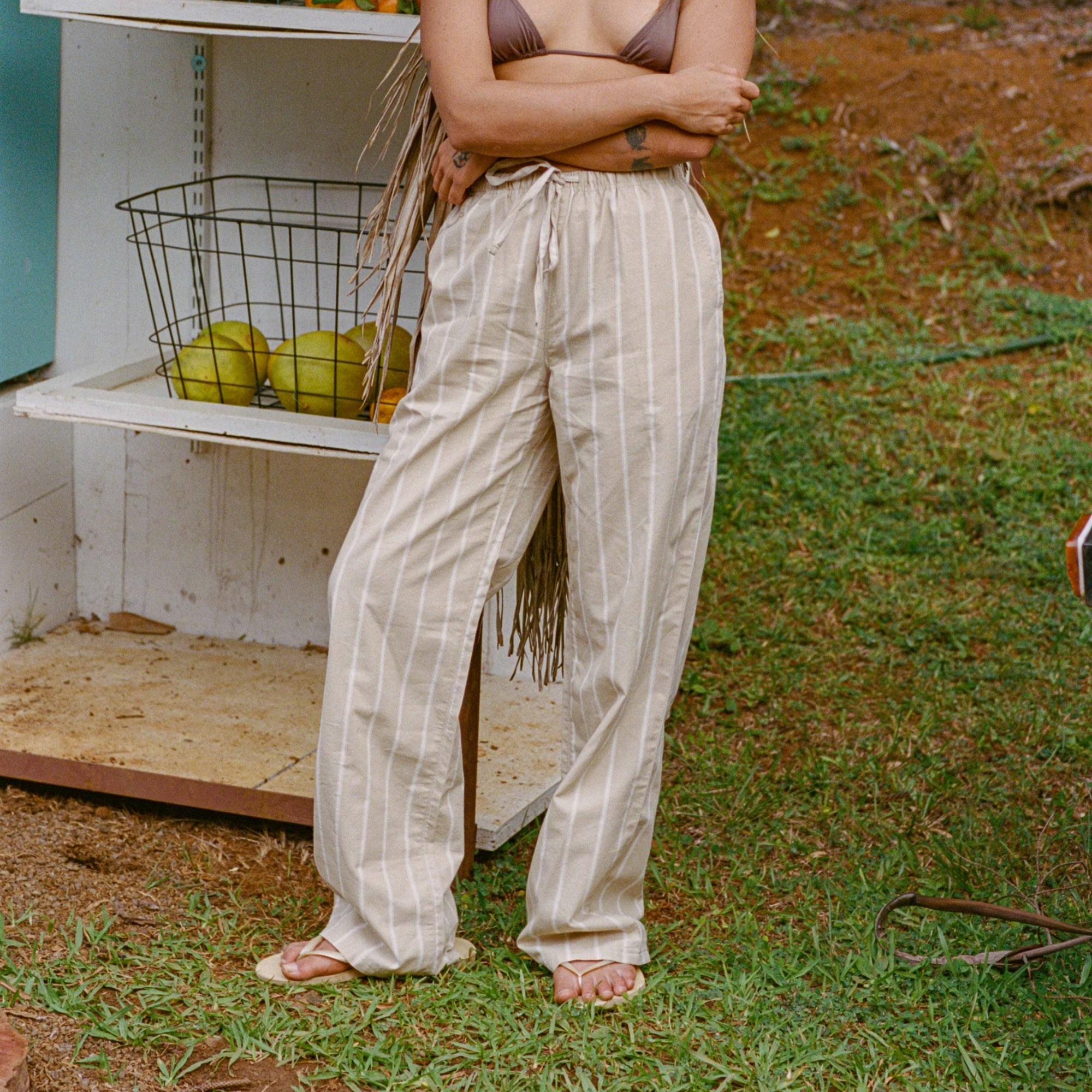 Men's casual adventure pants displayed in a laid-back nighttime setting, ideal for travel and outdoor activities by Roark.