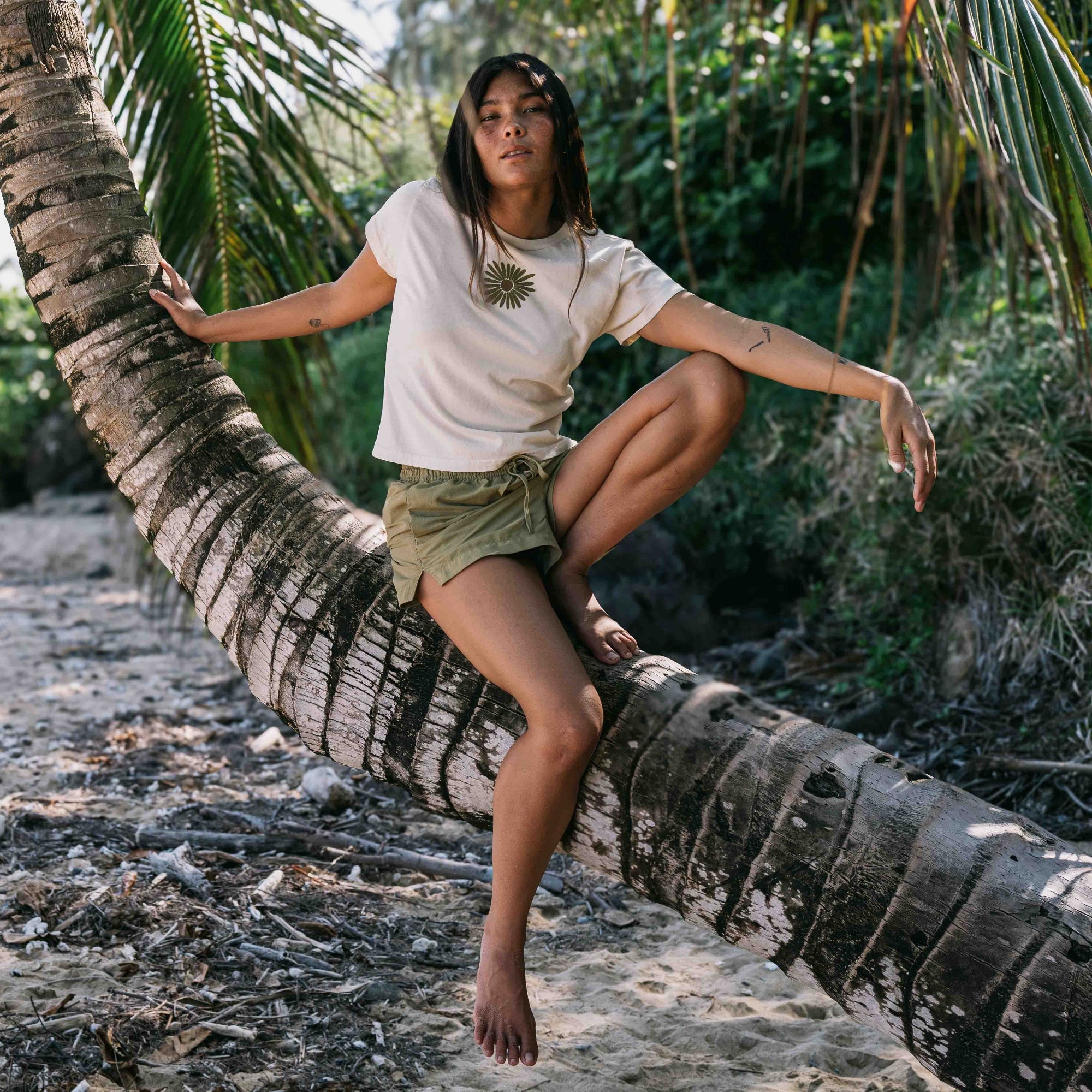 Model wearing a Flower Muse Premium Tee, embodying the spirit of summer and outdoor adventure, showcasing beauty and fashion by Roark.