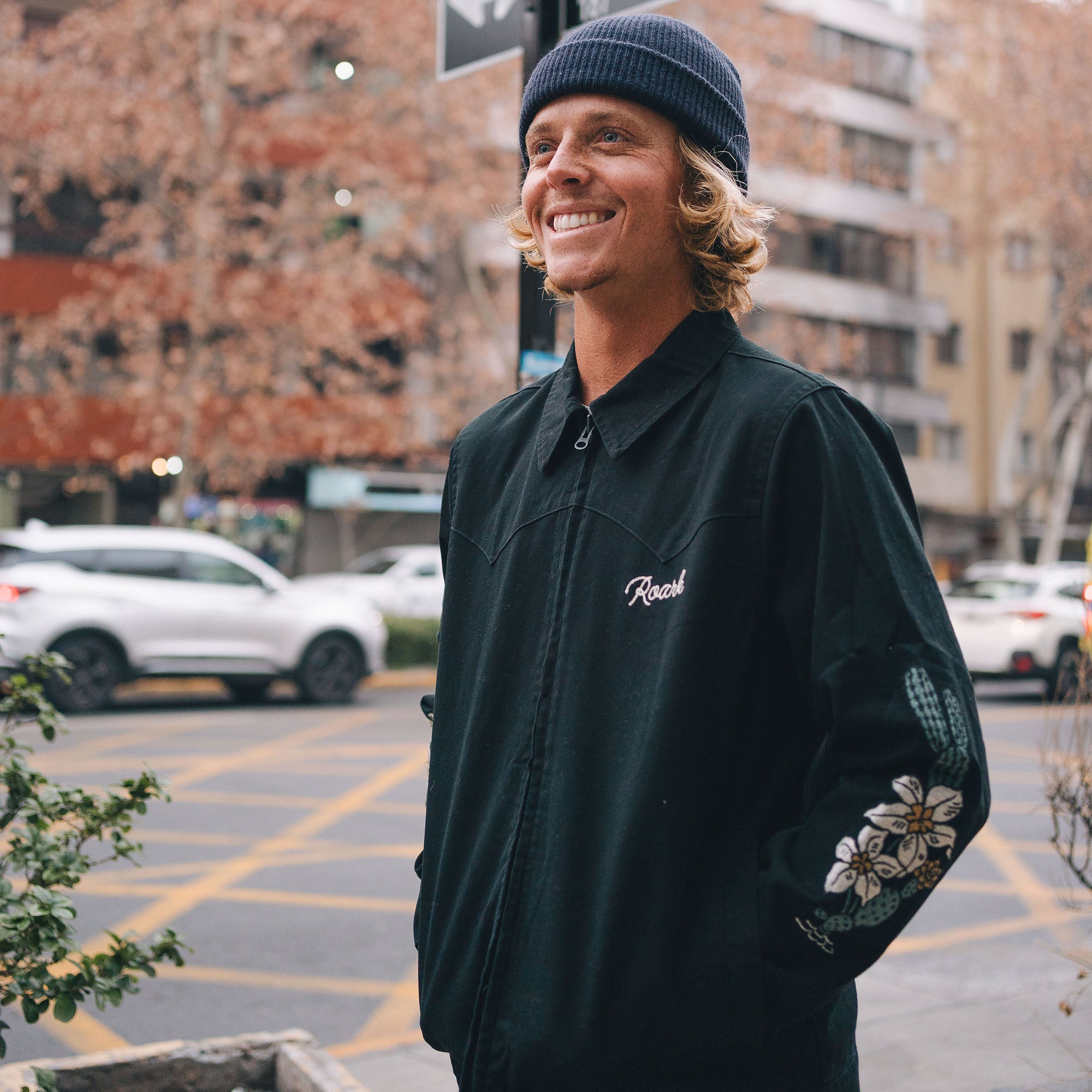 Person exploring scenic landscape wearing Roark Forever Roaming Jacket, embodying adventure and freedom.