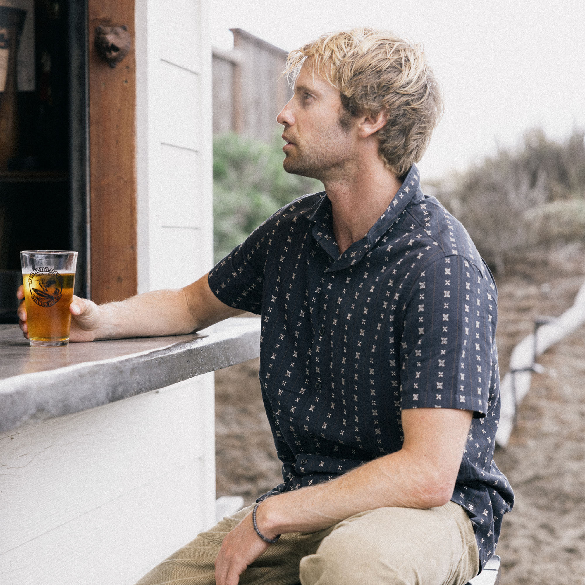 Close-up of a plaid Gonzo dress shirt featuring sturdy denim sleeves and detailed buttons, perfect for outdoor adventures.