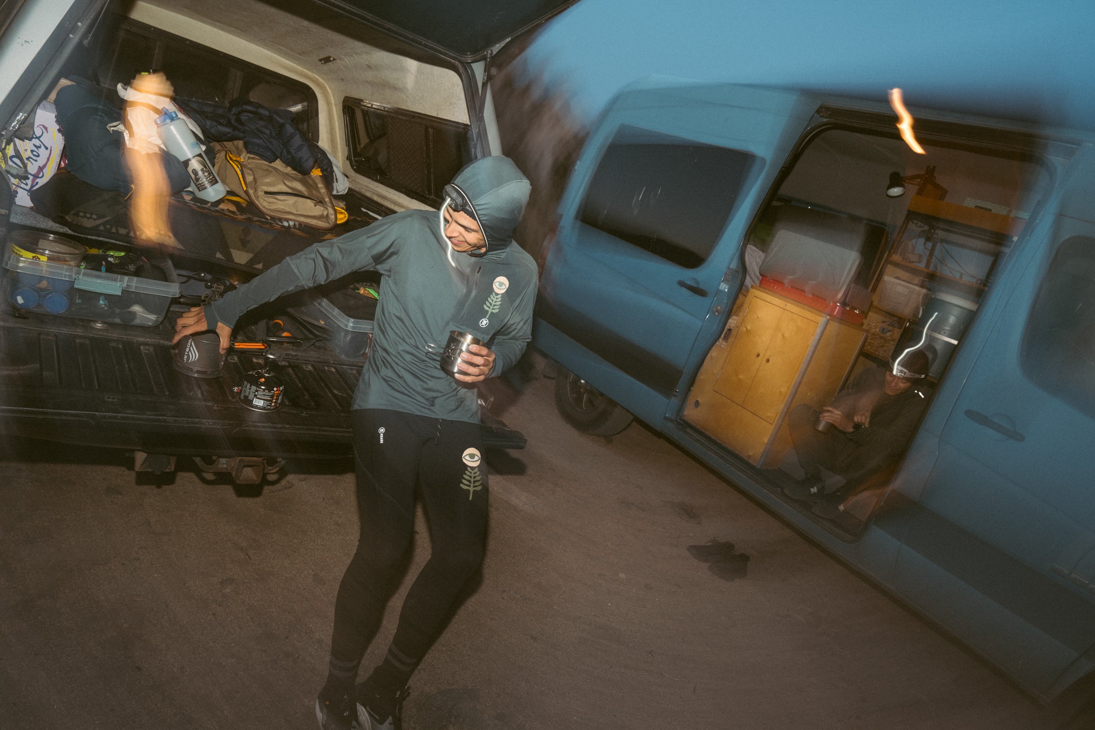 Outdoor adventure scene with an open minivan door revealing active pants and boots, ready for exploration, capturing the spirit of travel and adventure