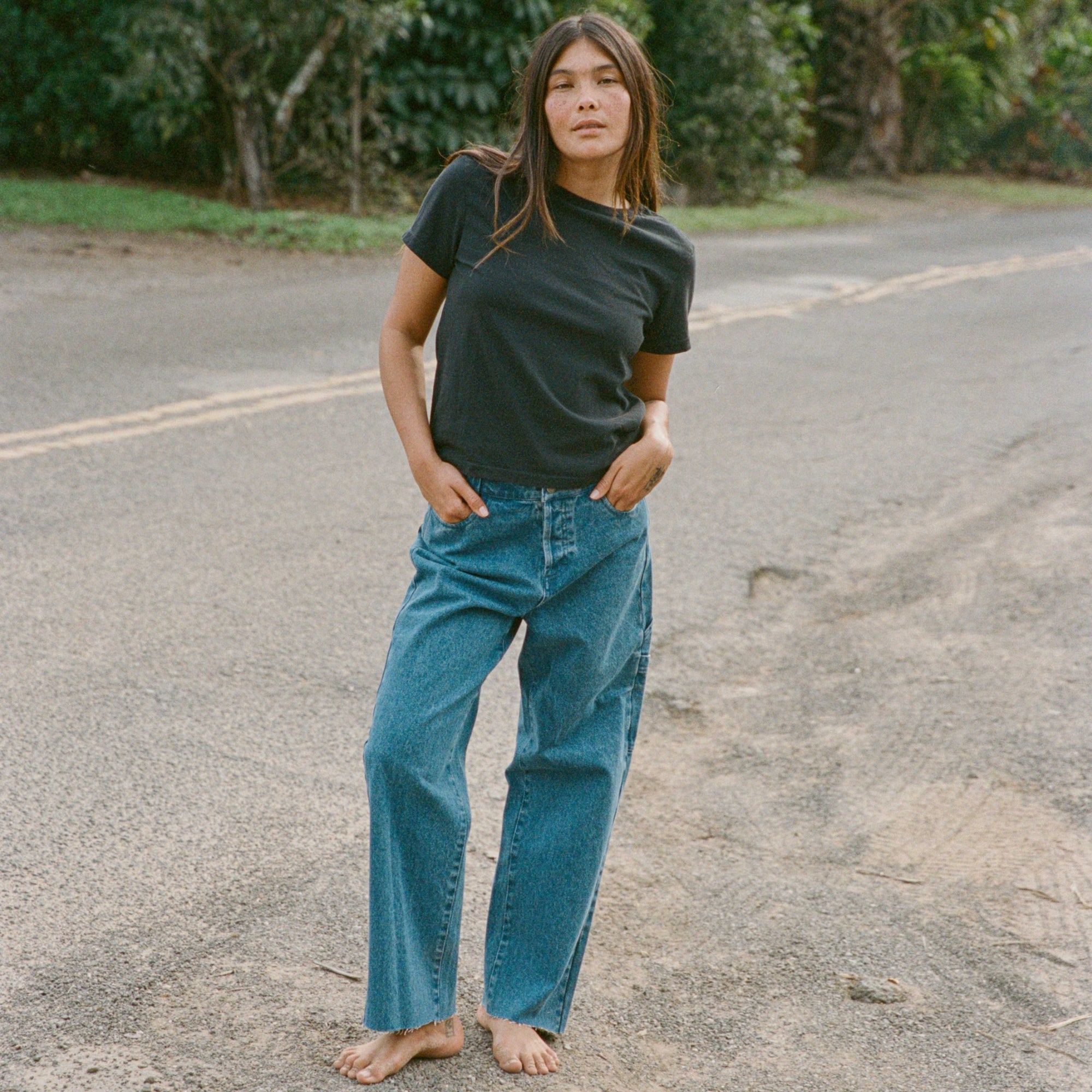 Man in HWY 1 Denim Pants enjoying a scenic outdoor setting, capturing a sense of adventure and leisure.