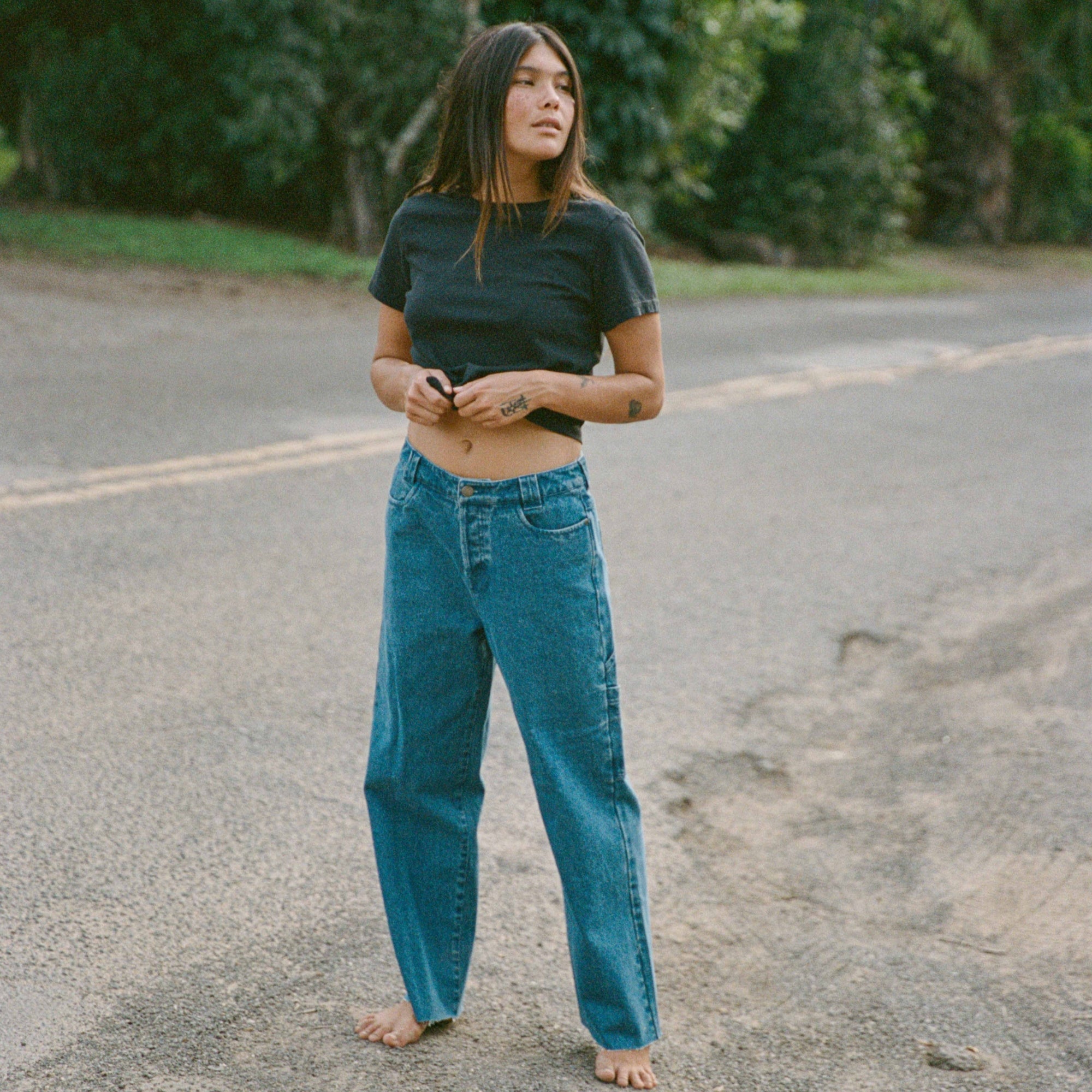 Close-up of a rugged HWY 1 Denim Pant by Roark, highlighting durable denim fabric perfect for adventure and travel.