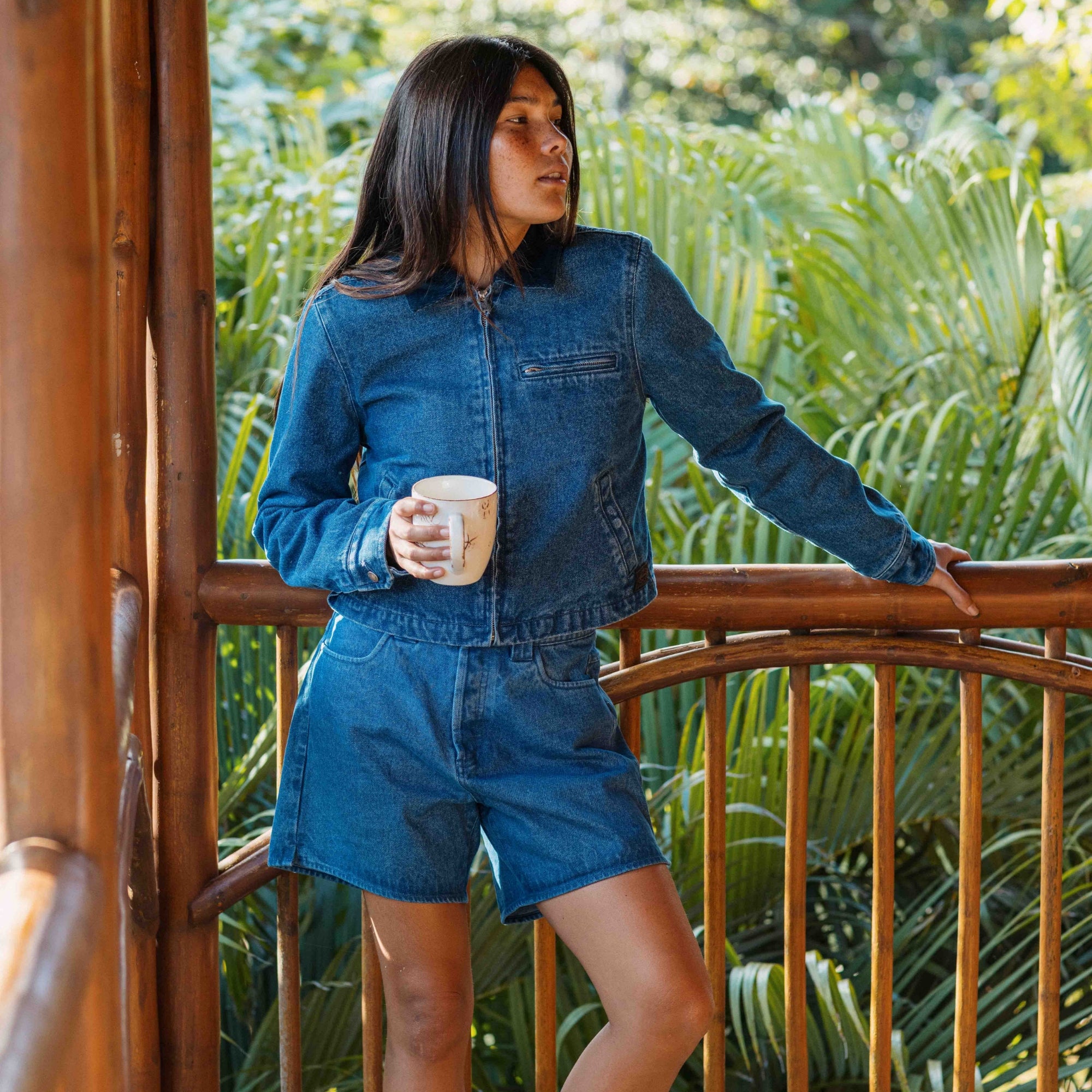 Stylish denim HWY 1 shorts featuring a smart collar and distinctive button detailing, perfect for adventure and travel.