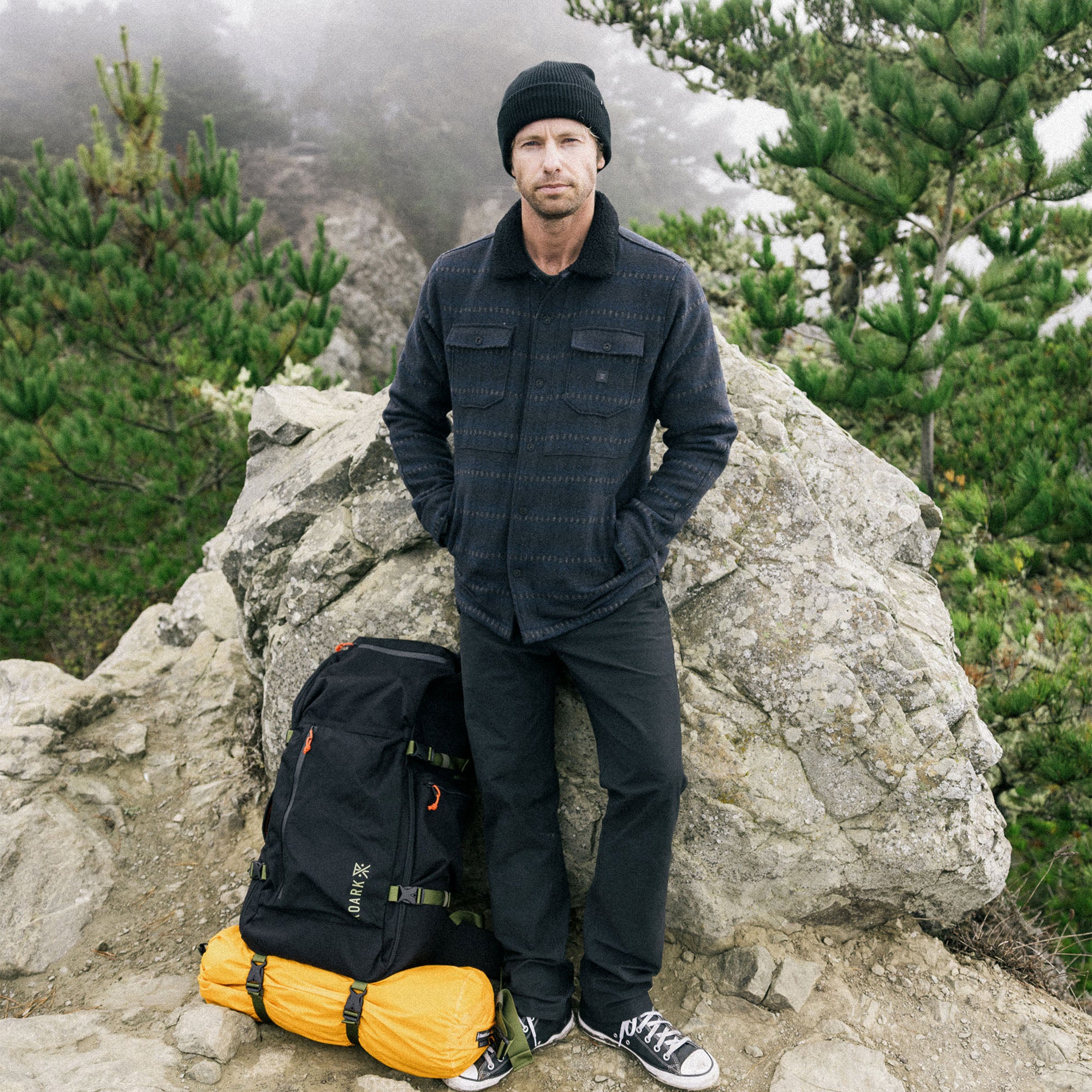 Adventurous traveler wearing the Roark Hebrides Jacket HO25, ideal for winter vacations and outdoor recreation.