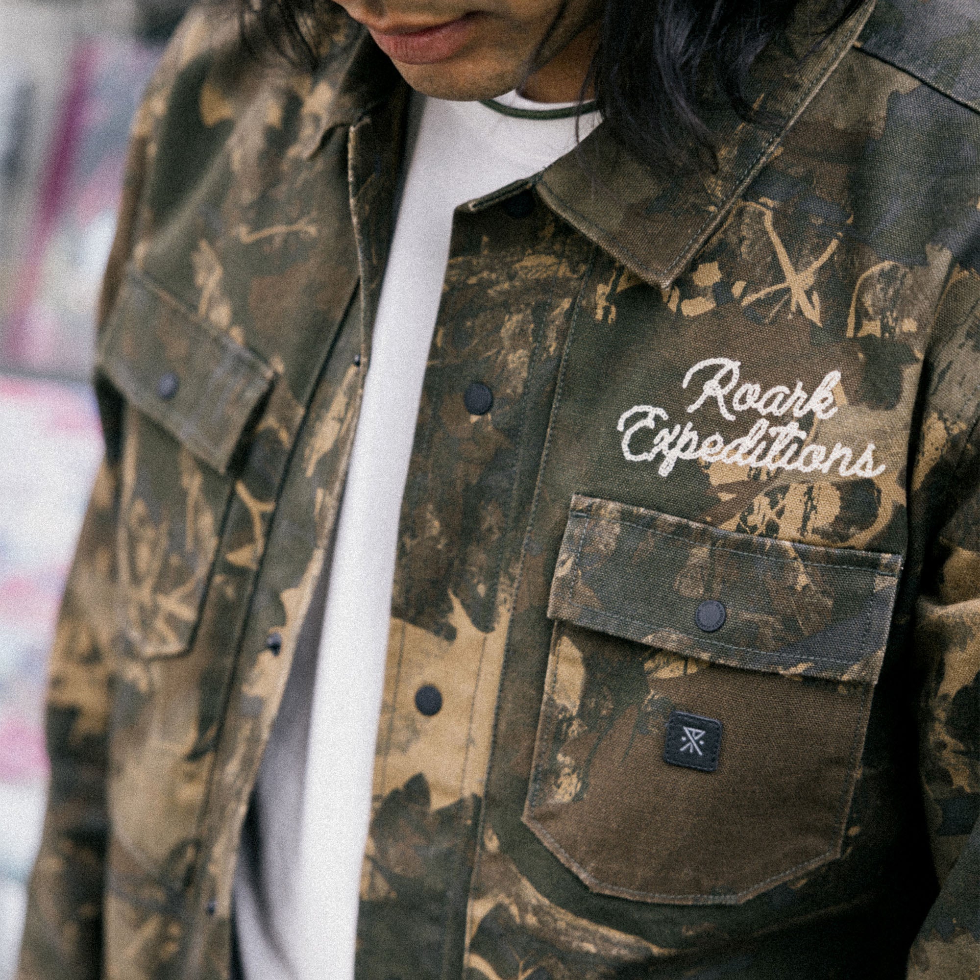 Active camouflage shirt styled with Roark's Hebrides Unlined Jacket HO25, perfect for adventure and outdoor activities.