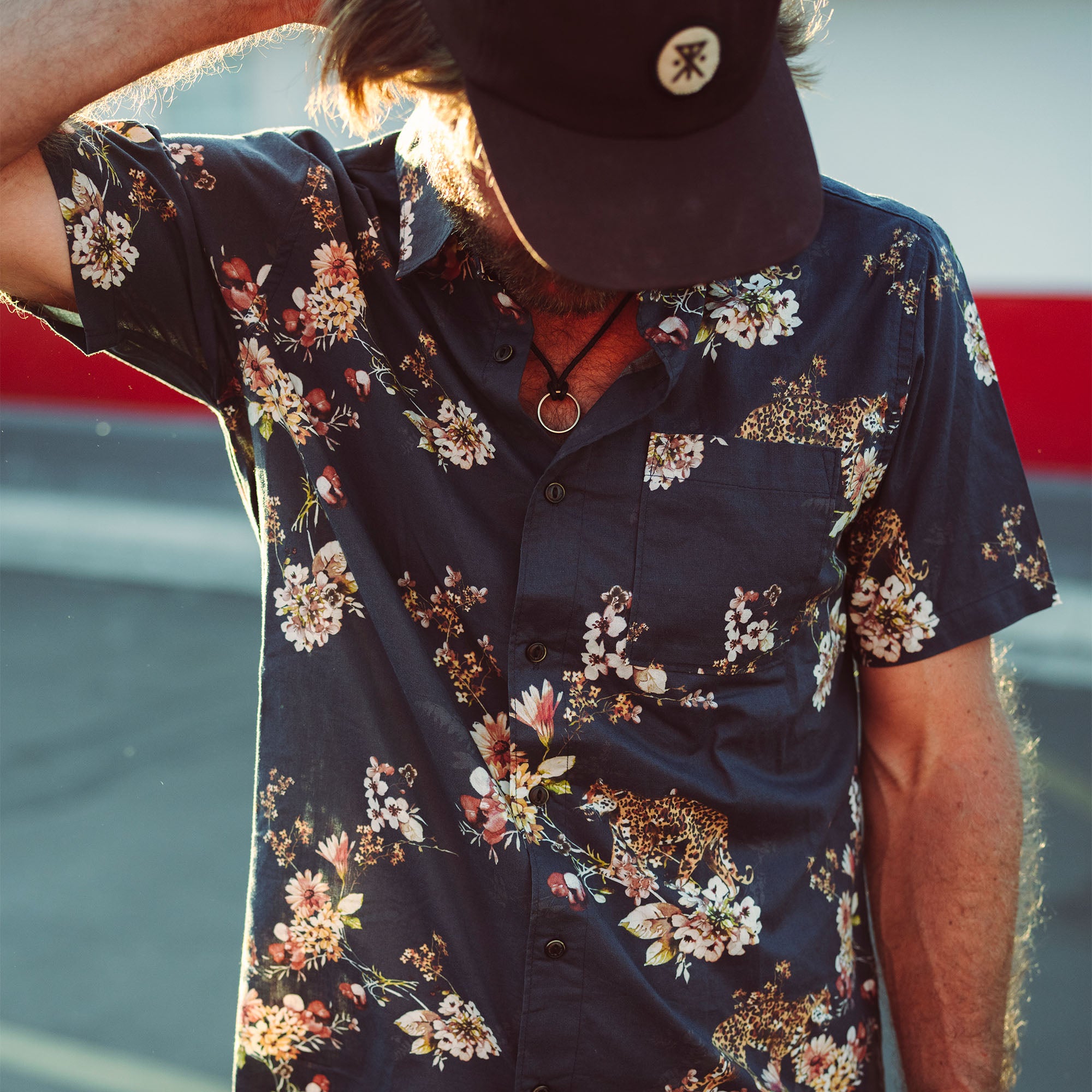 Active travel shirt featuring a collar, buttons, and sleeves, paired with a sun hat, perfect for outdoor adventures.