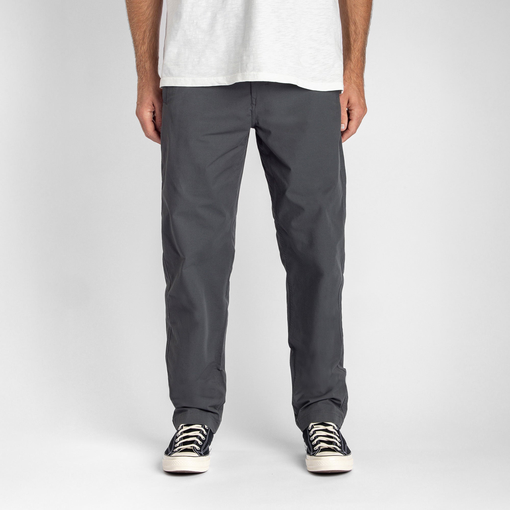 Charcoal Layover Pro Collection displayed on a rugged, natural bedrock and rubble surface, embodying Roark's adventure and travel spirit.