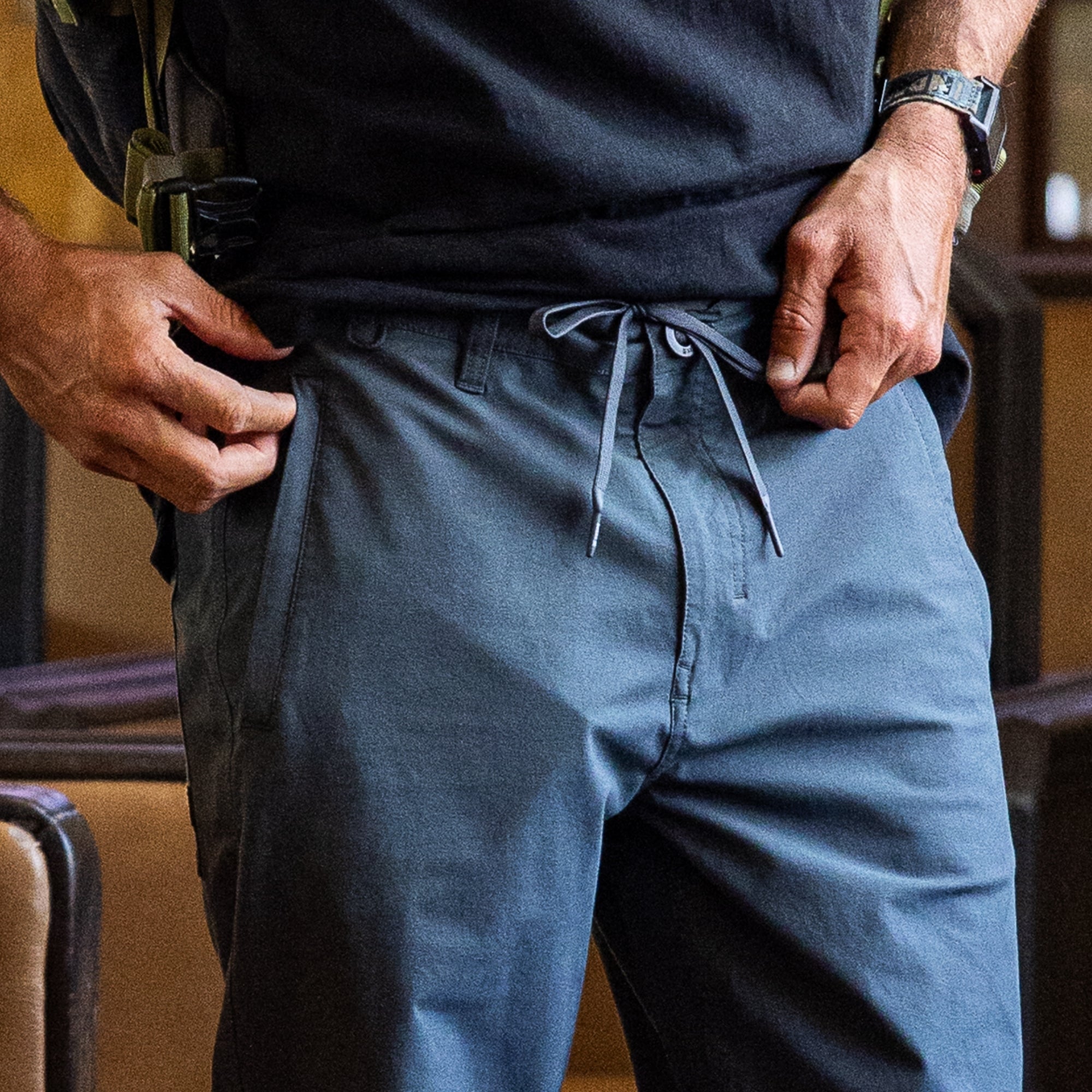Versatile Layover Pro Pants by Roark, featuring practical pockets and styled as Bermuda shorts, perfect for outdoor adventures and travel.
