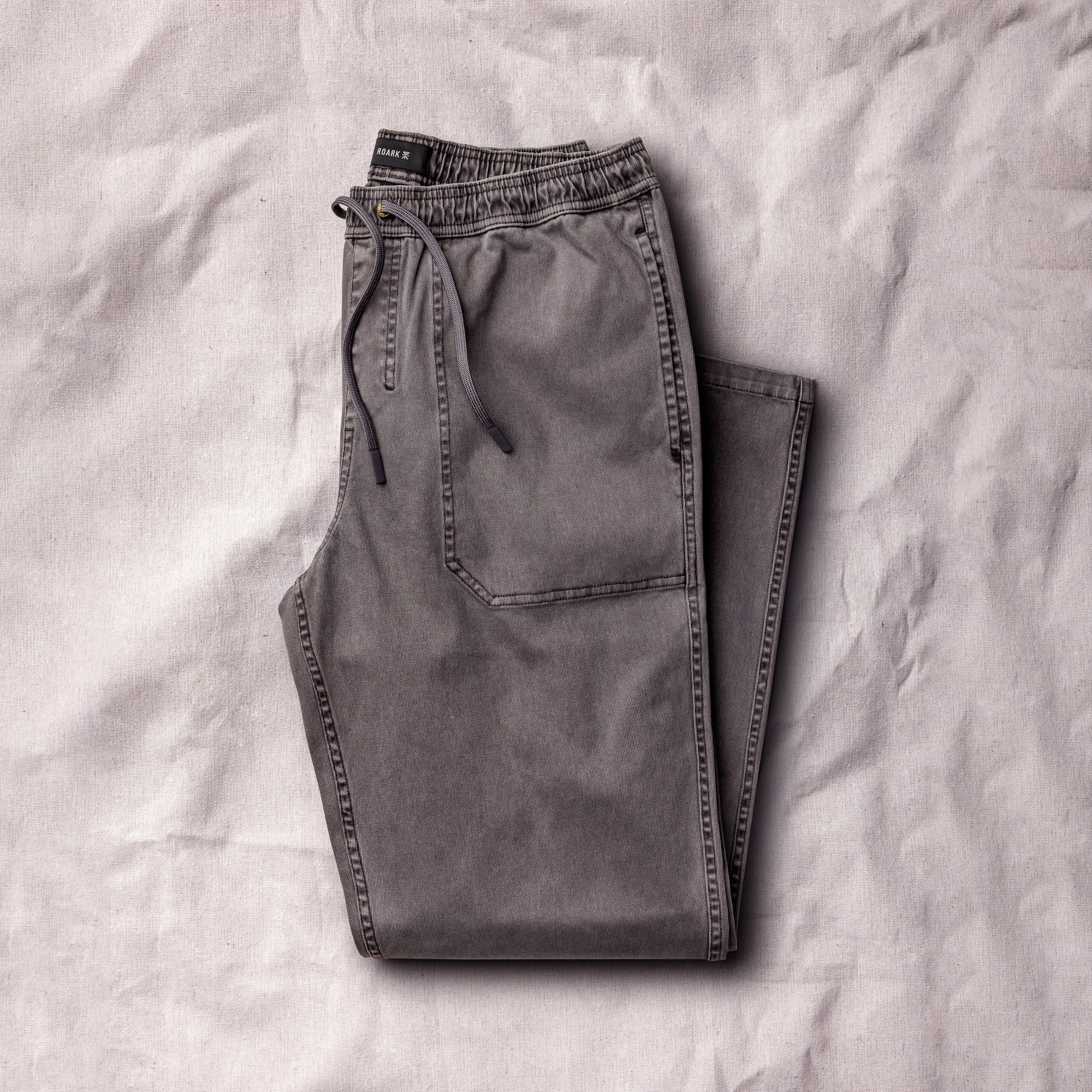Roark Made To Fade Pants from Fall Collection 2025 set against an adventurous outdoor backdrop