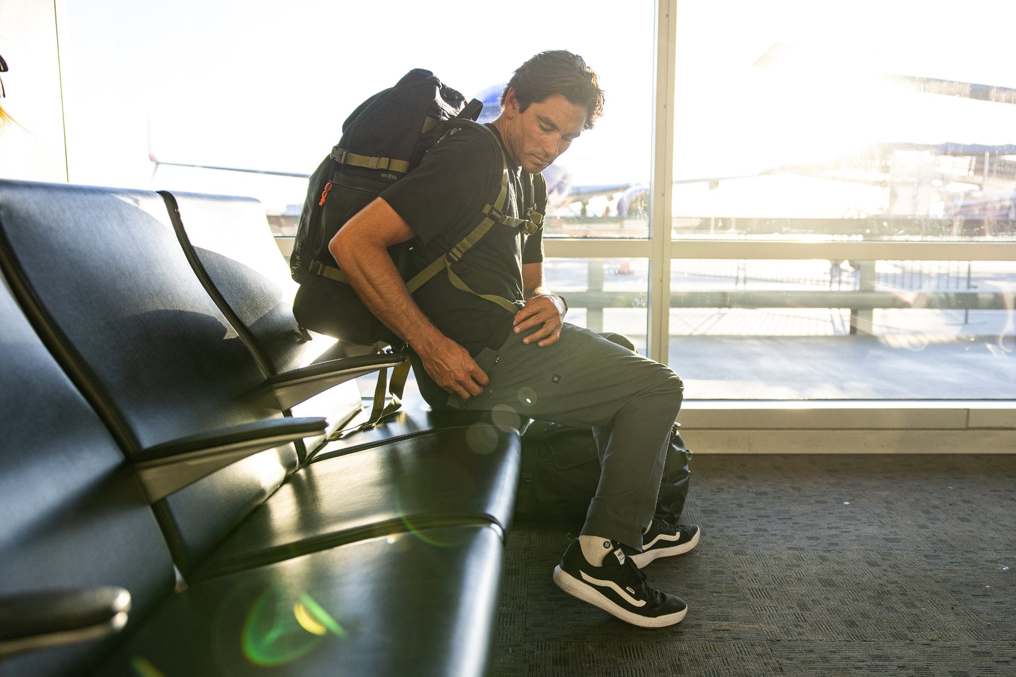 Assorted adventure gear featuring sneakers, backpack, and travel bags by Roark, tailored for outdoor enthusiasts and travelers.