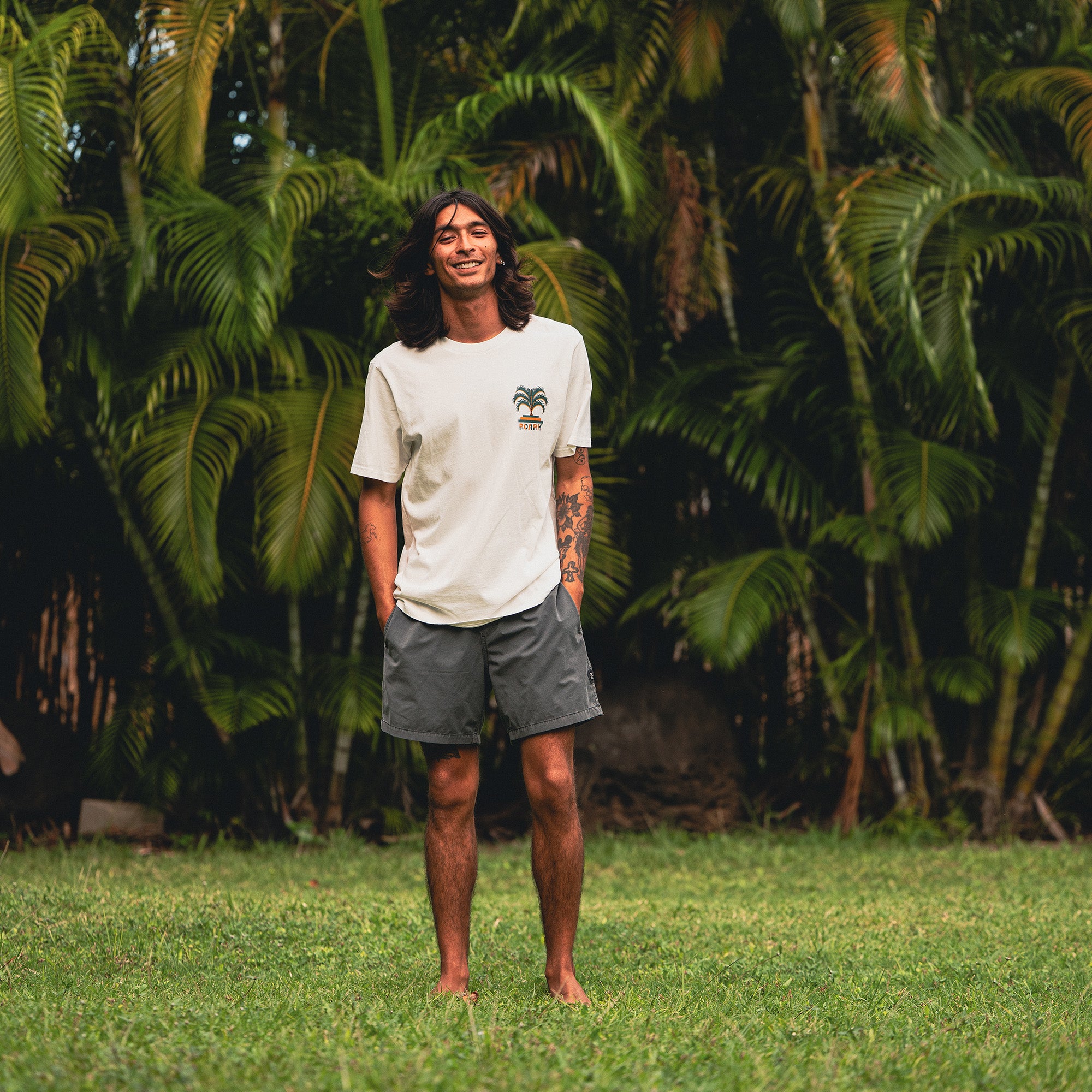 Group of people enjoying outdoor activities in nature, wearing a variety of shorts including boardshorts and active shorts, embodying Roark's spirit of adventure and travel.