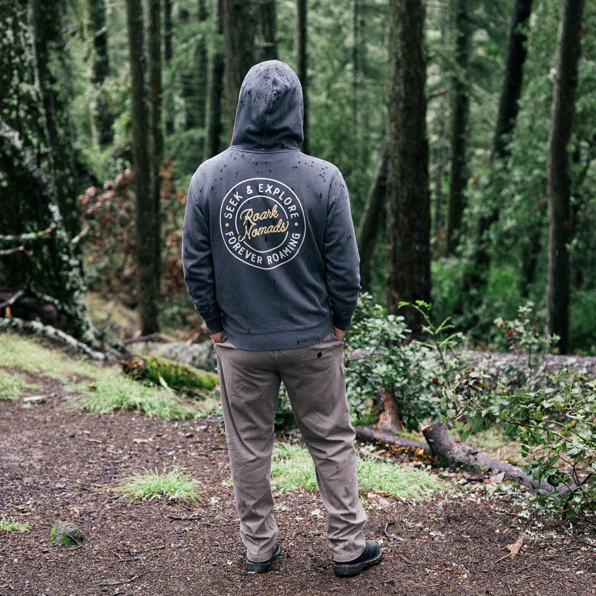 Group of adventurers wearing denim and Nomads Badge fleece hoodies in a natural setting, embodying the spirit of outdoor exploration.