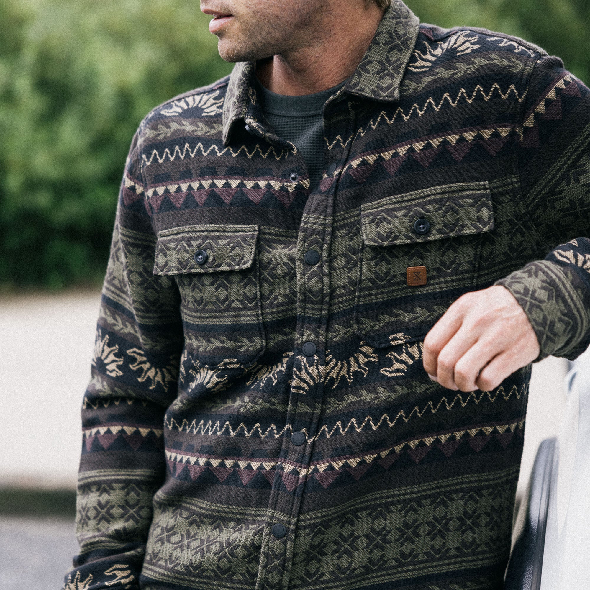Conifer trees background enhancing the wilderness vibe for Roark's Nordsman Jacquard Long Sleeve Flannel HO25.