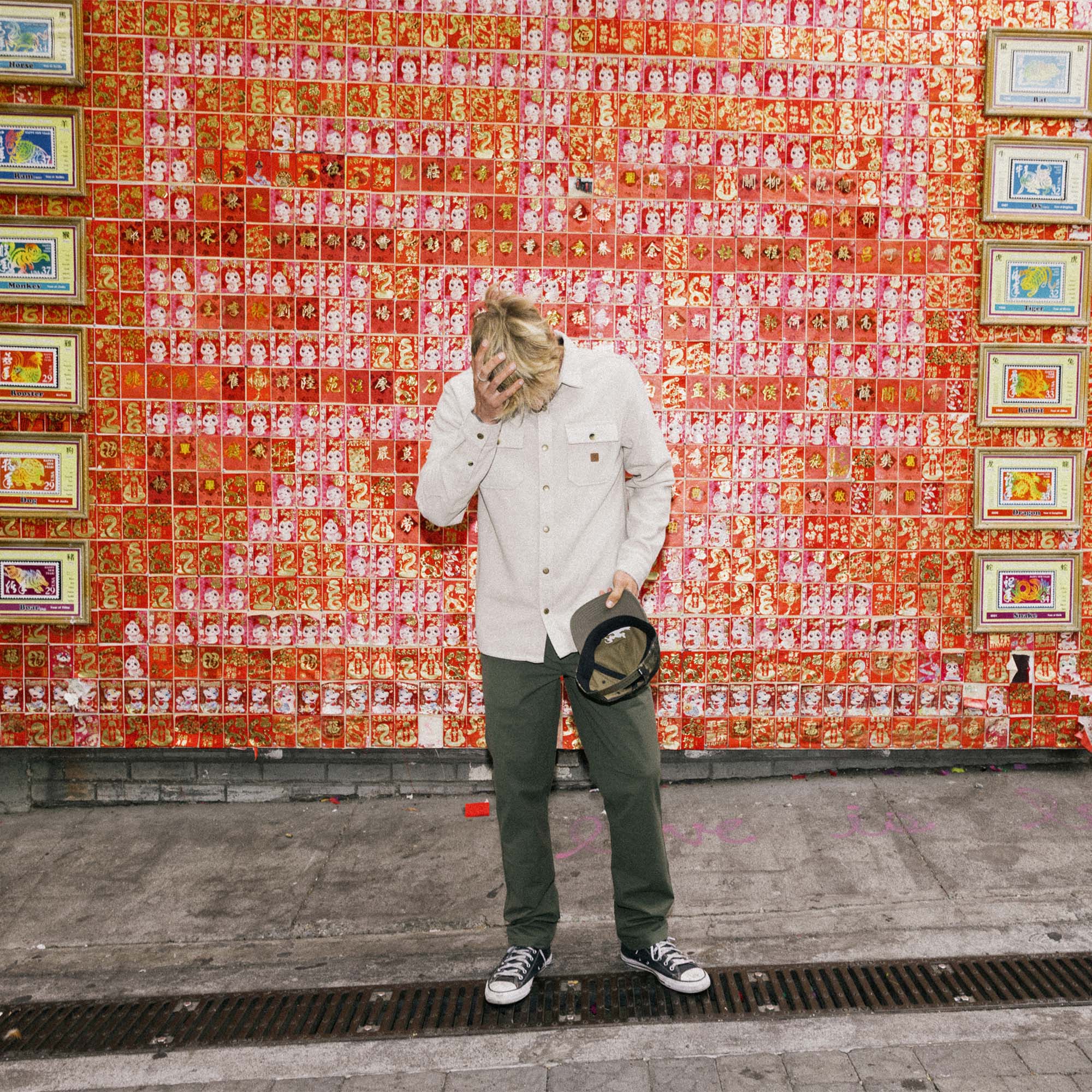 Person walking with a bag while wearing a Roark Nordsman Long Sleeve Flannel, embodying adventure and travel.