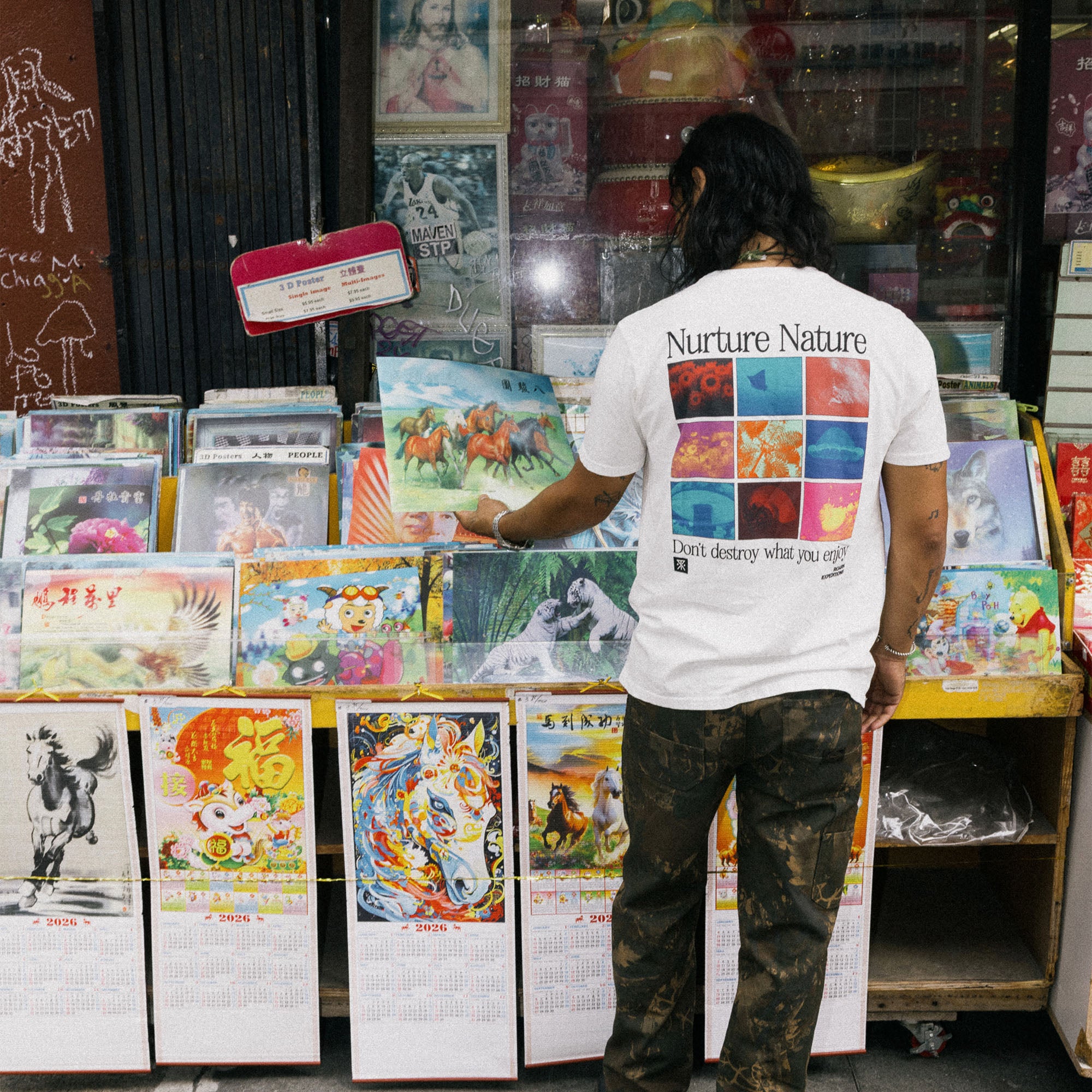 Artistic design featuring a fictional character on the Nurture Nature Premium Tee by Roark, ideal for adventure and travel enthusiasts.