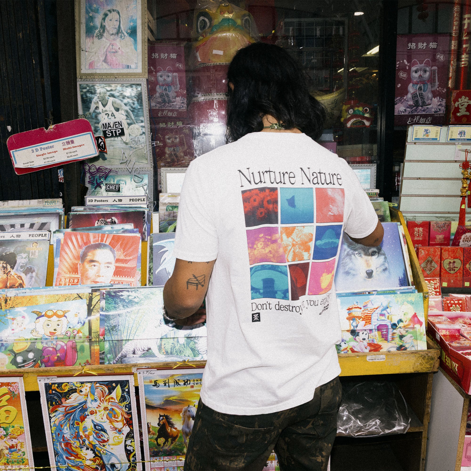 Man with a beard wearing Roark's Nurture Nature Premium Tee featuring an intricate graphic design, perfect for outdoor adventures.