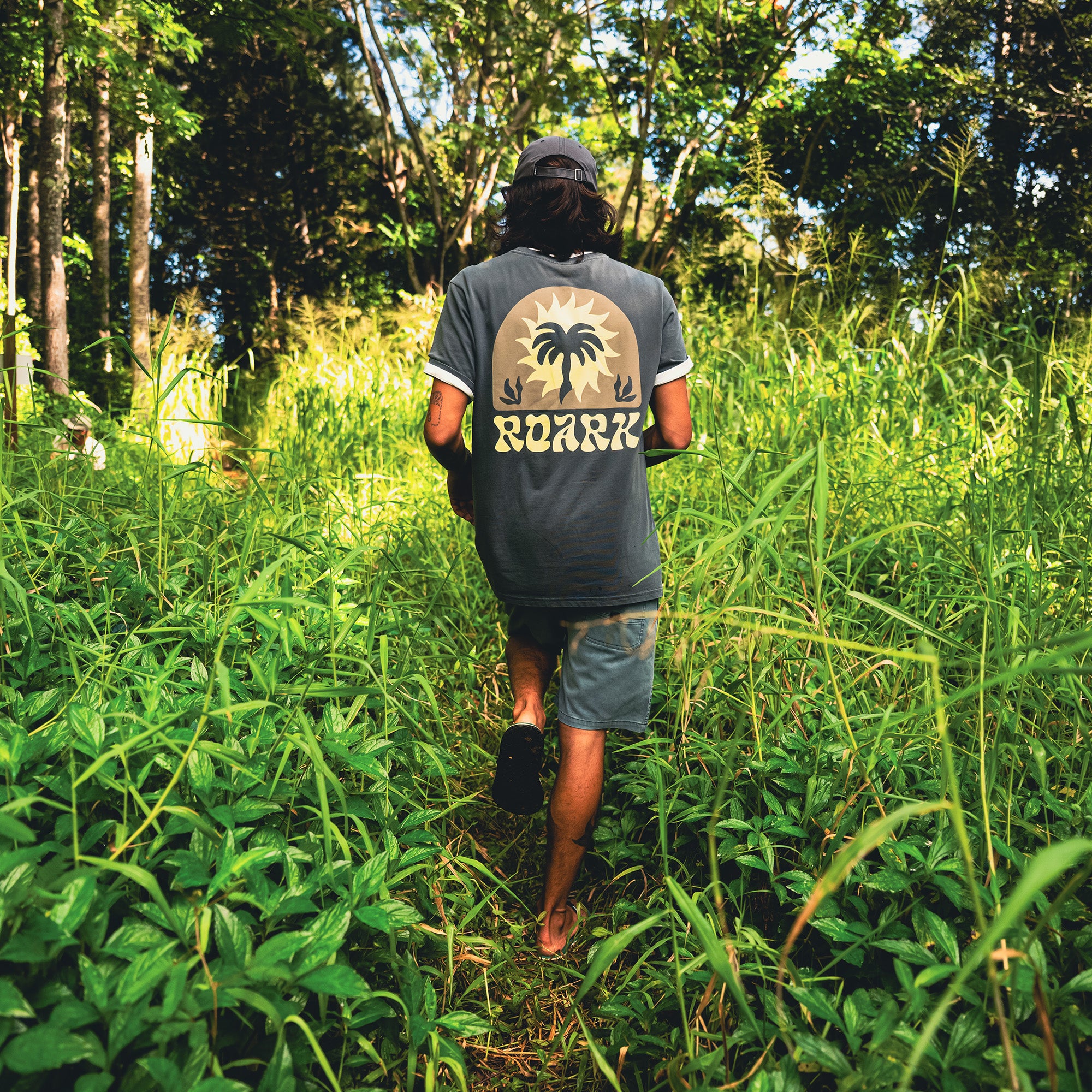 Active t-shirt with jungle and palm tree design, made from sustainable hemp, perfect for outdoor adventures by Roark.