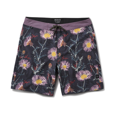 Roark durable onyx trunks and boardshorts, perfect for adventure and travel, displayed in a natural setting.