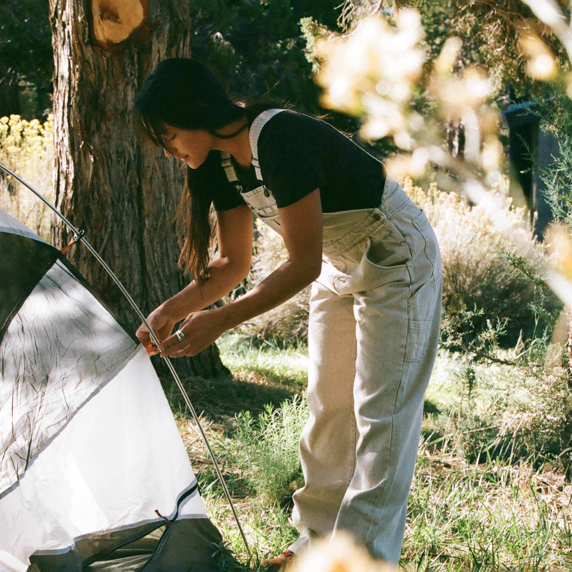 Roark man wearing a t-shirt and shorts in a sunny outdoor setting, showcasing Roark's Leave-Behind lifestyle collection