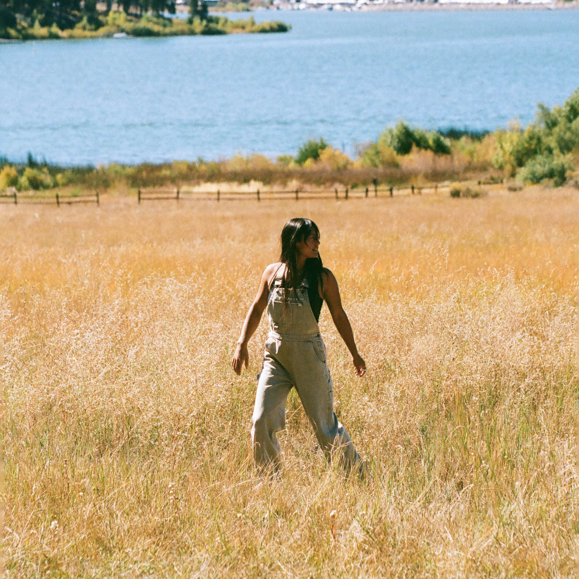 Roark man wearing a t-shirt and shorts in a sunny outdoor setting, showcasing Roark's Leave-Behind lifestyle collection