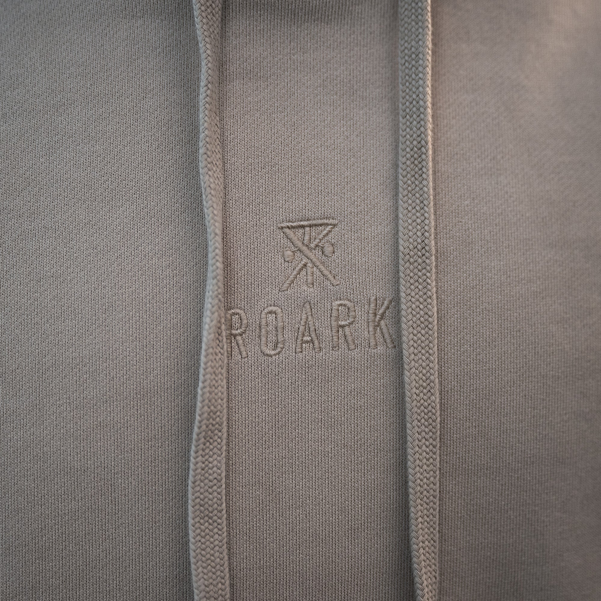 Grey hooded fleece with intricate Safe Camp embroidery, perfect for outdoor adventures with Roark SP26 collection