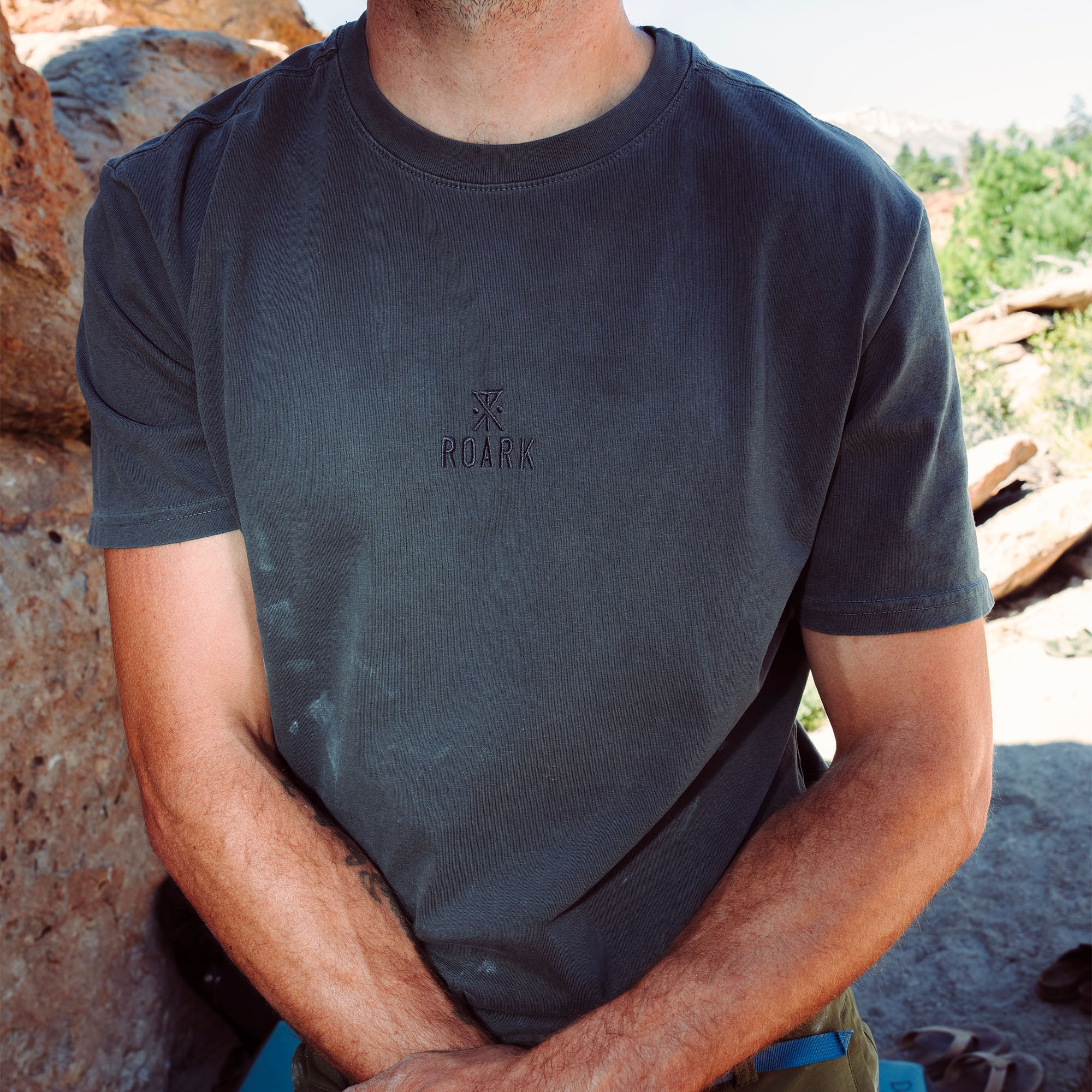 Close-up of a Roark Safe Camp Embroidery Tee for Fall 2025 featuring detailed sleeve and torso design, perfect for active outdoor adventures.