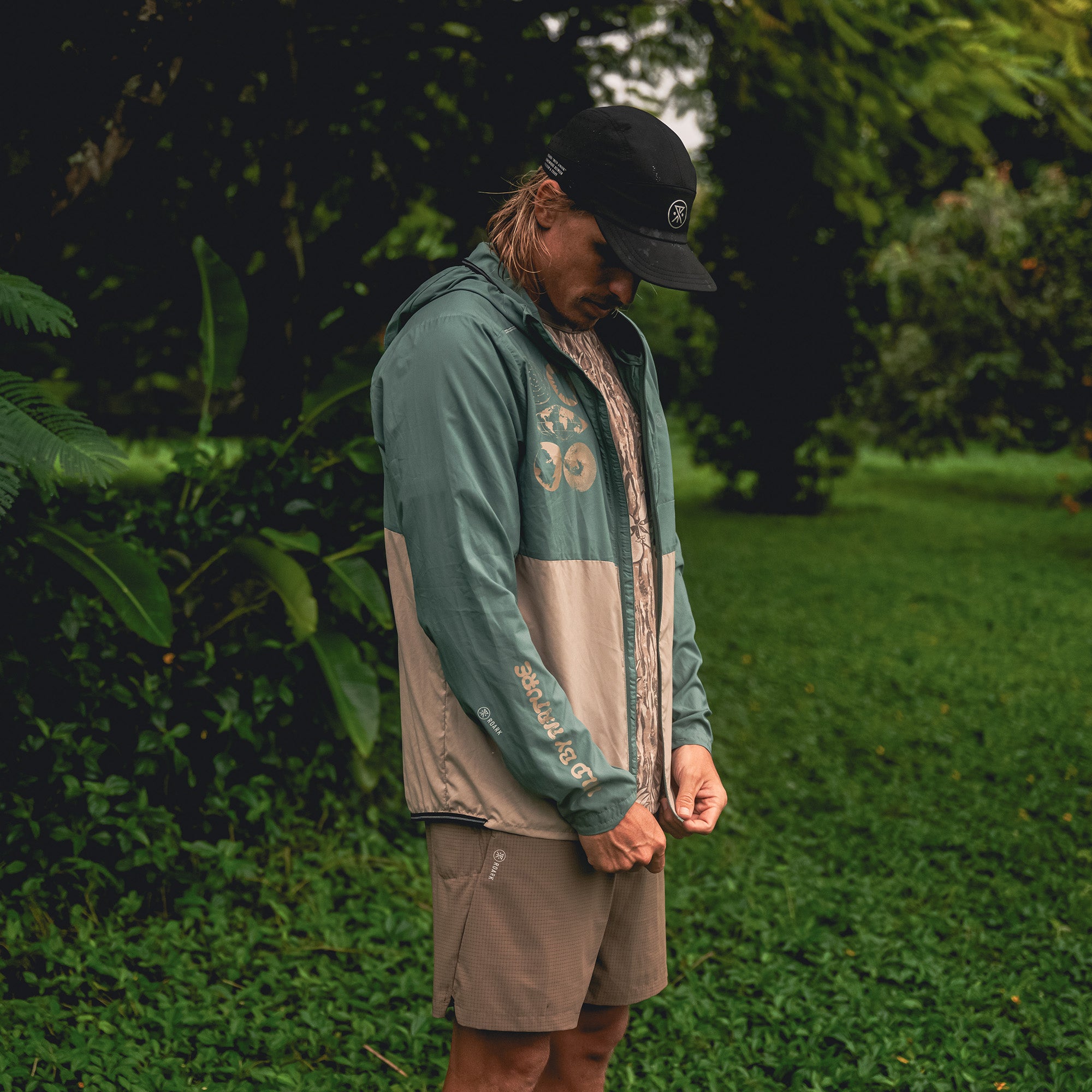 Versatile Secondwind 3.0 hooded windbreaker jacket designed for adventure and travel, showcasing durability and style.