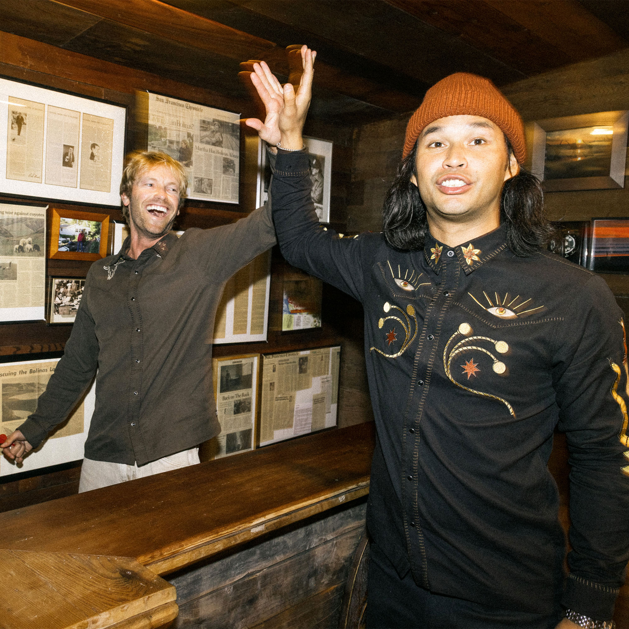 Smiling man with a beard, wearing the Roark Tierra del Sur Range Long Sleeve Button Up Shirt, embodying a sense of adventure and style.