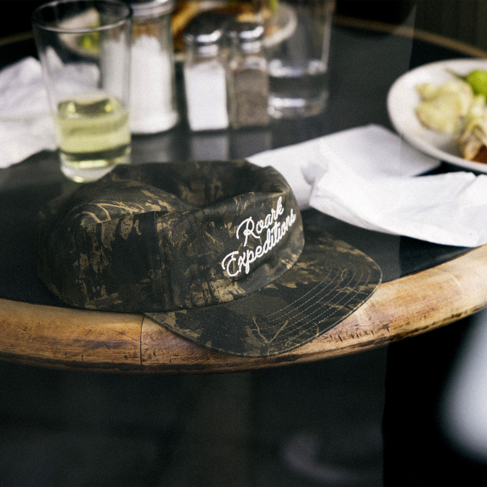 Stylish Roark Venture Snapback Hat displayed against an outdoor background, perfect for adventure and travel.