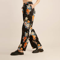 The model of Roark Women's PIC Pants - Camellia Black