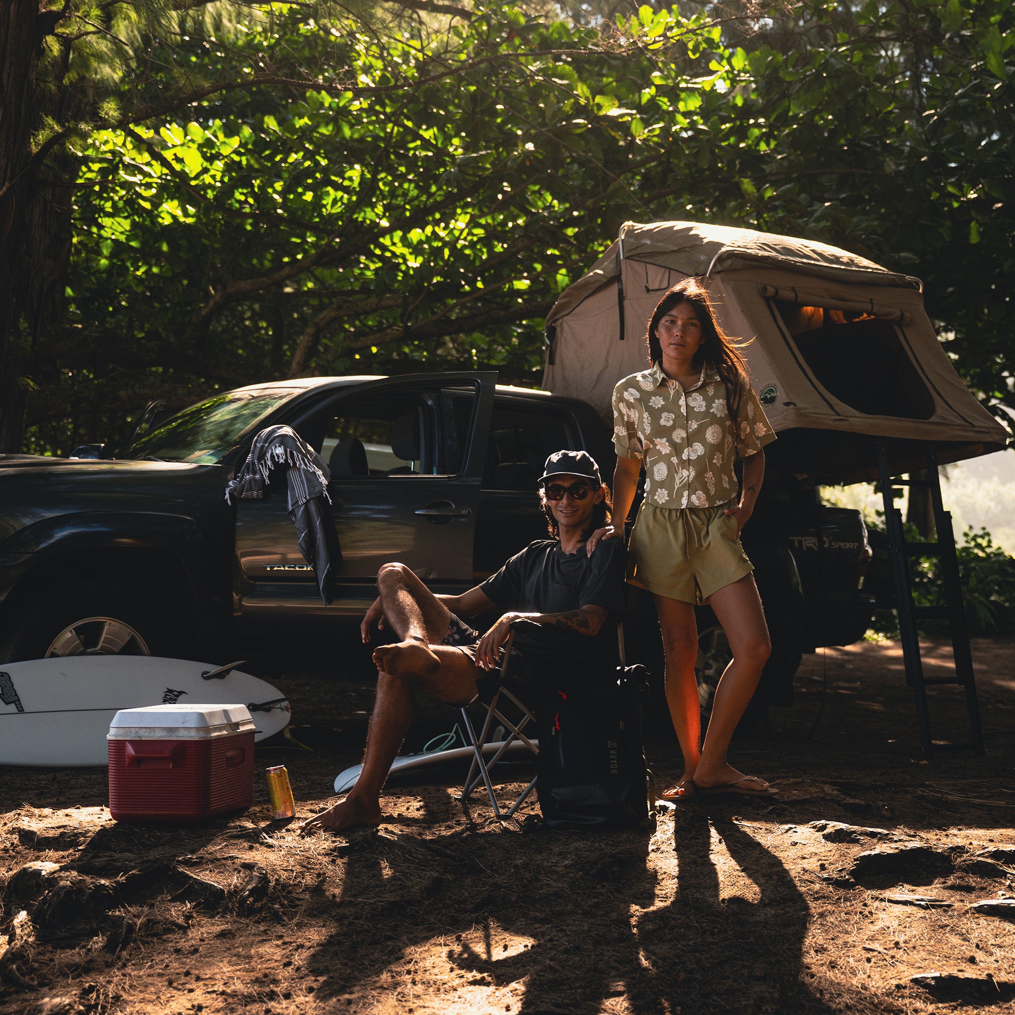 Outdoor camping scene with a tent set up in a beautiful natural setting, promoting adventure and travel with Roark's outdoor-inspired aesthetic.