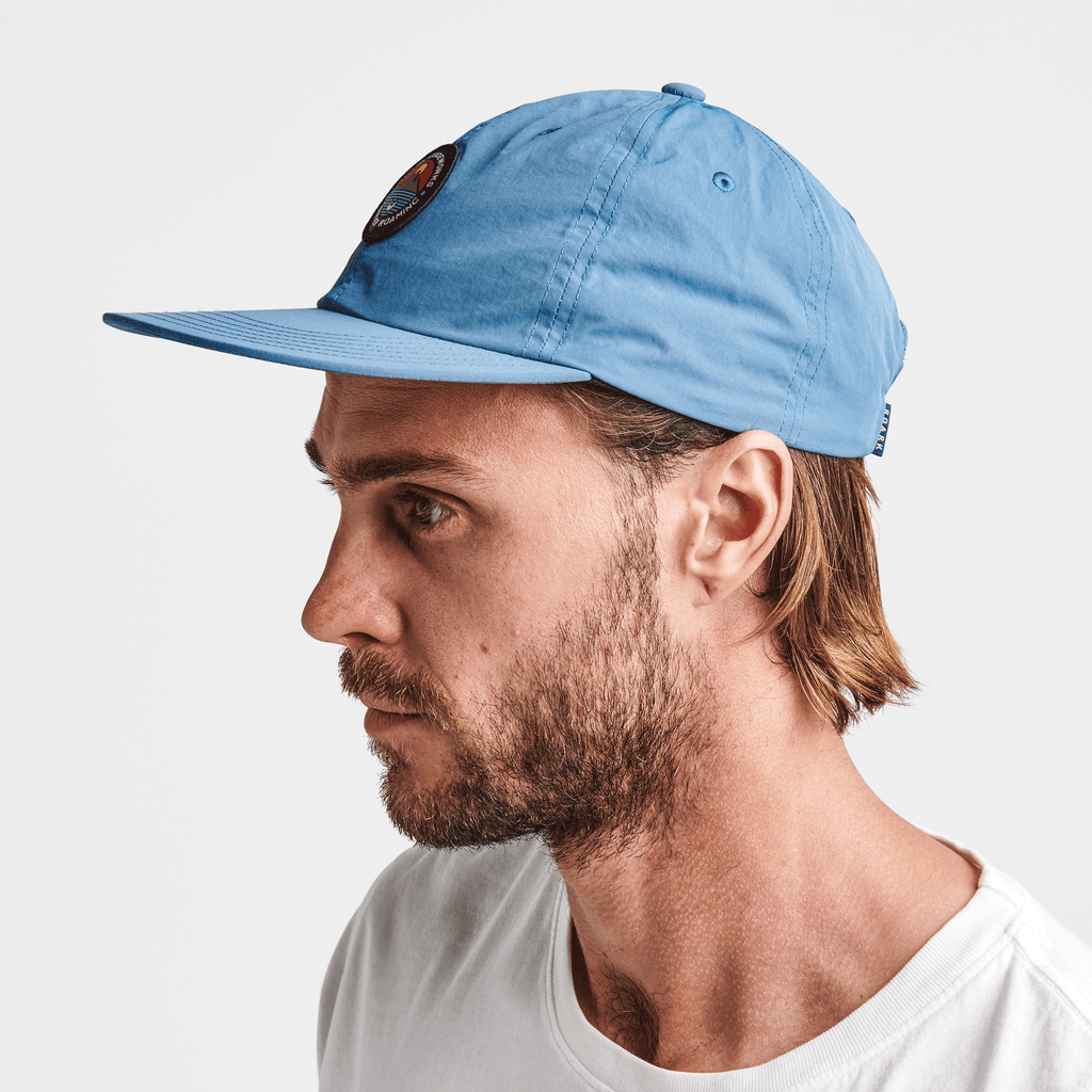 The on body view of Roark's Sun Up Sun Down 6 Panel Strapback Hat - Hydro Blue Big Image - 4