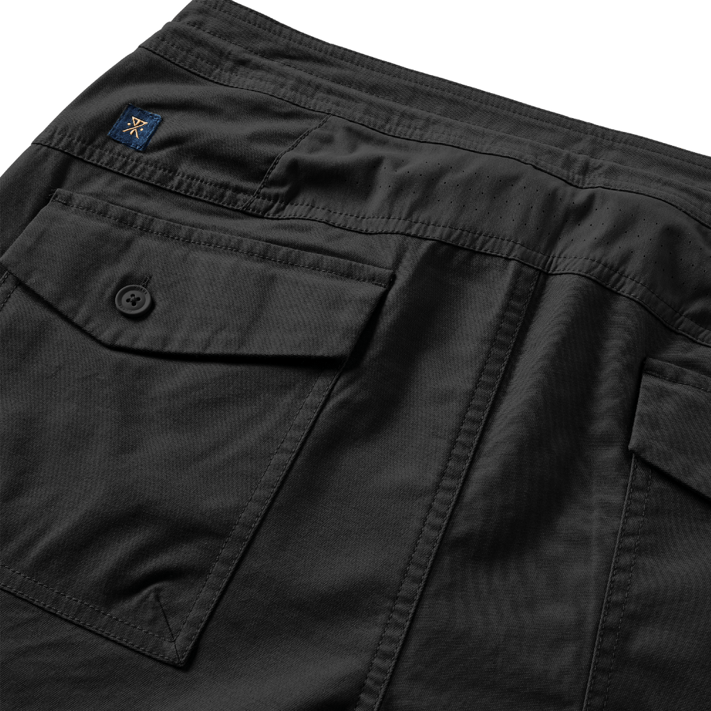 The back pockets, ventilated fabric, and logo of Roark's Layover Relaxed 2.0 Pants - Black Big Image - 4